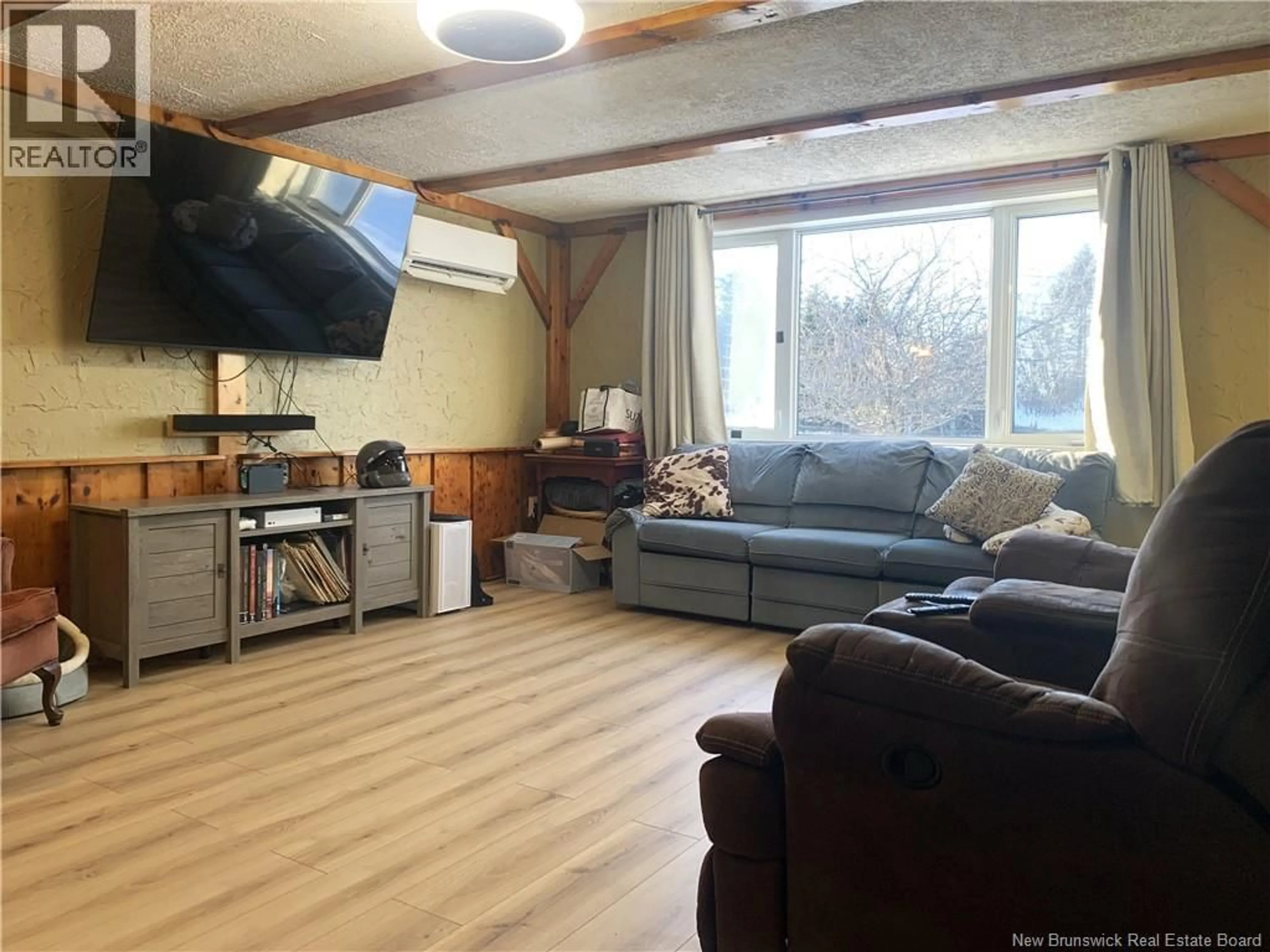 Living room with furniture, wood/laminate floor for 704 ROUTE 617, Birdton New Brunswick E3G9H2