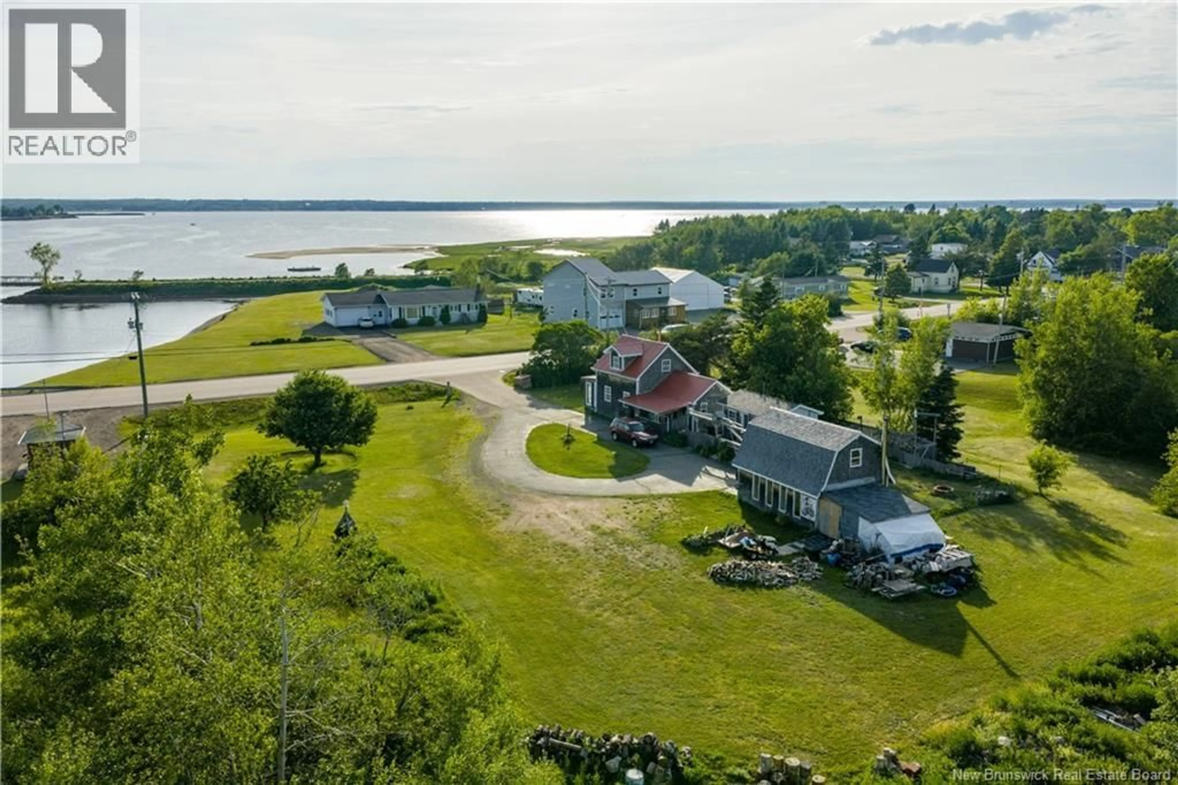 A pic from outside/outdoor area/front of a property/back of a property/a pic from drone, water/lake/river/ocean view for 137 POINTE DU CHENE ROAD, Pointe-Du-Chêne New Brunswick E4P4S9