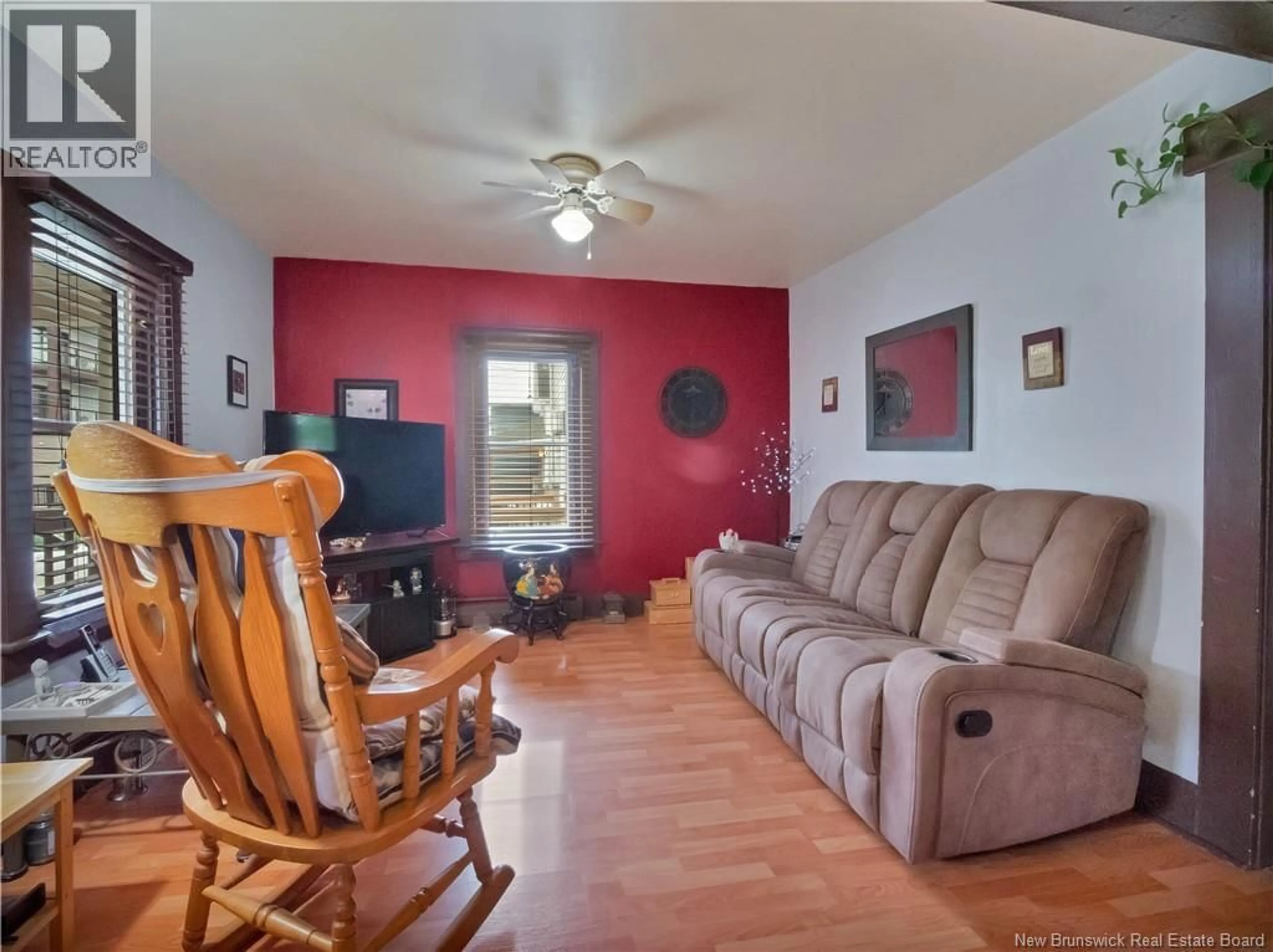 Living room with furniture, wood/laminate floor for 58 ELM STREET, Moncton New Brunswick E1C5T6