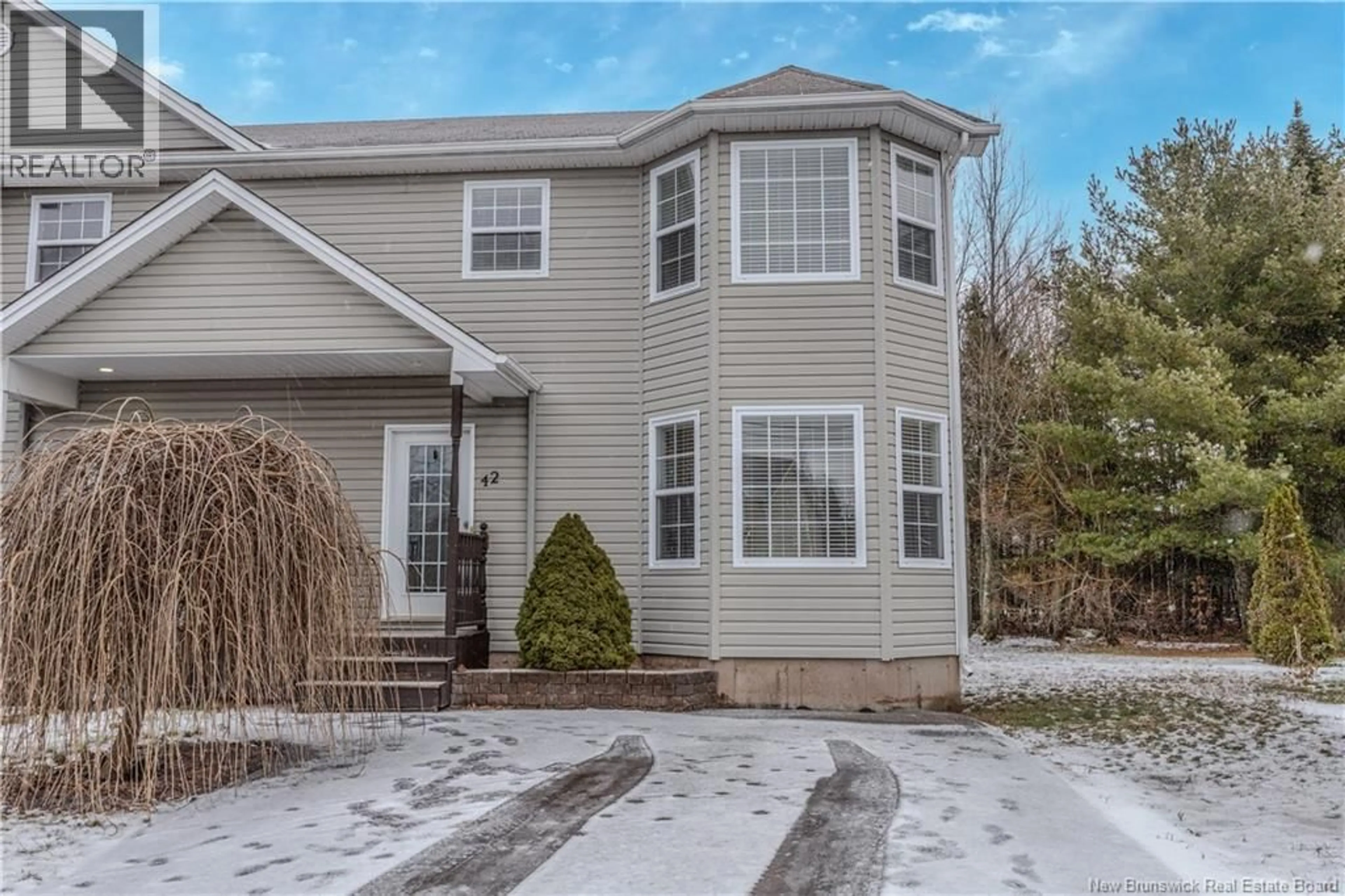 Home with vinyl exterior material, street for 42 CHABLIS, Dieppe New Brunswick E1A0N2