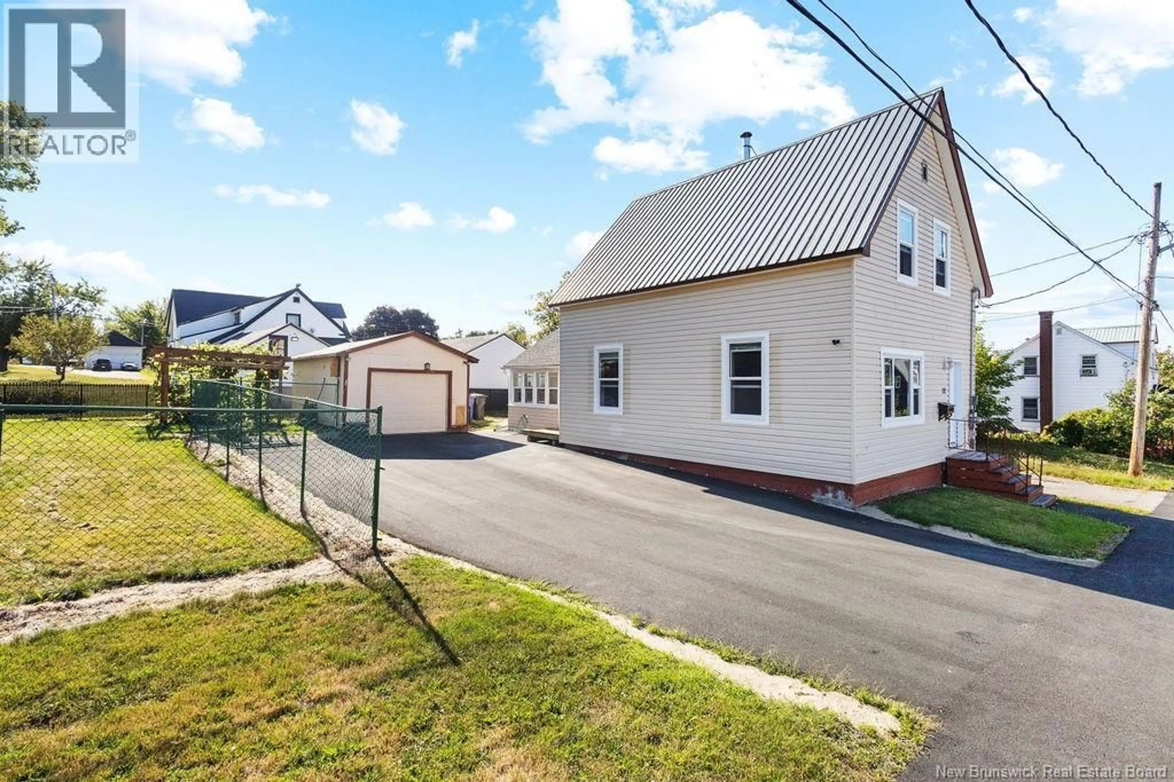 A pic from outside/outdoor area/front of a property/back of a property/a pic from drone, street for 72 CUNARD STREET, Miramichi New Brunswick E1N2T6