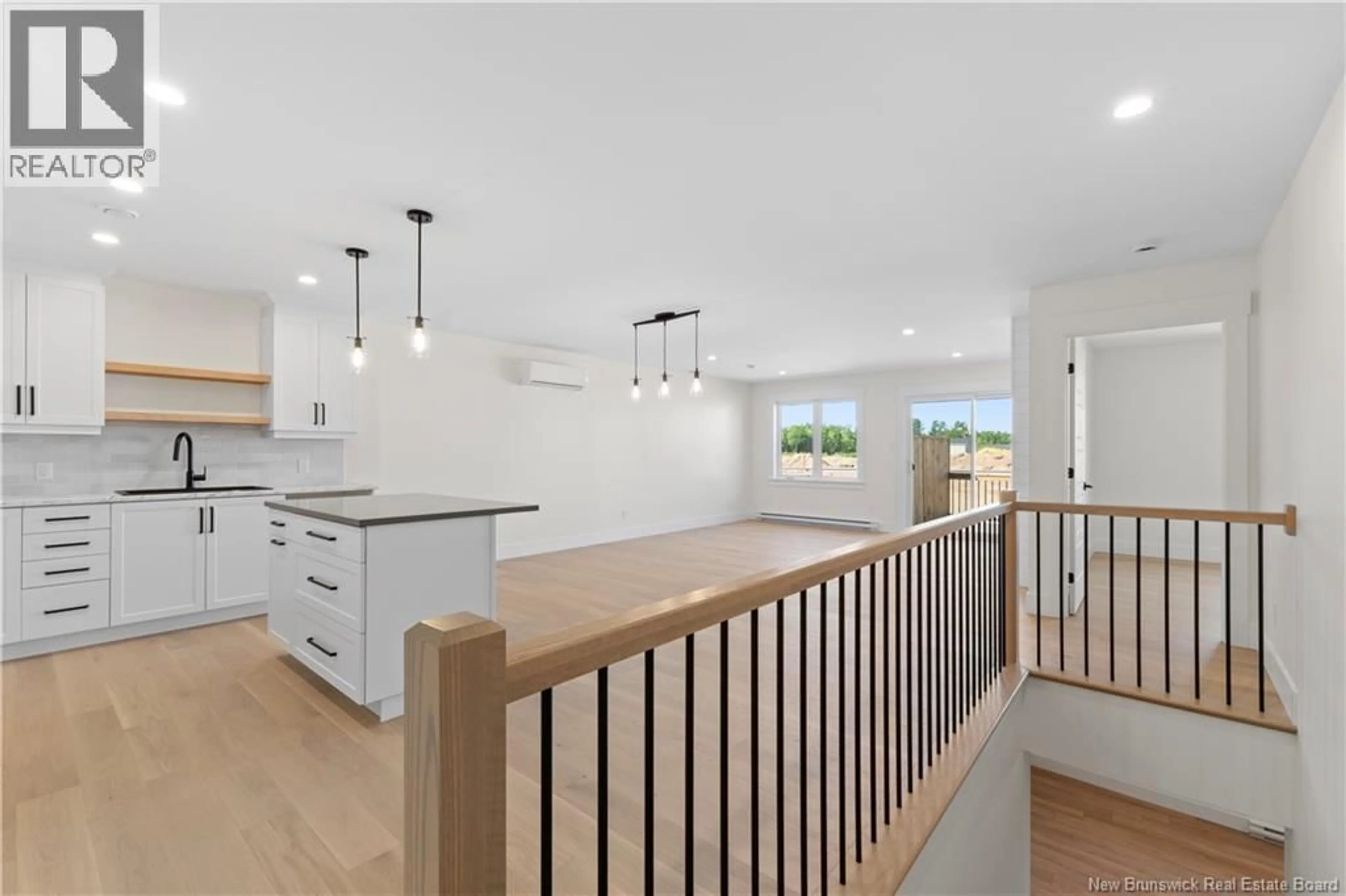 Open concept kitchen, wood/laminate floor for 219 SIMONE GALLANT STREET, Shediac New Brunswick E4P2B7