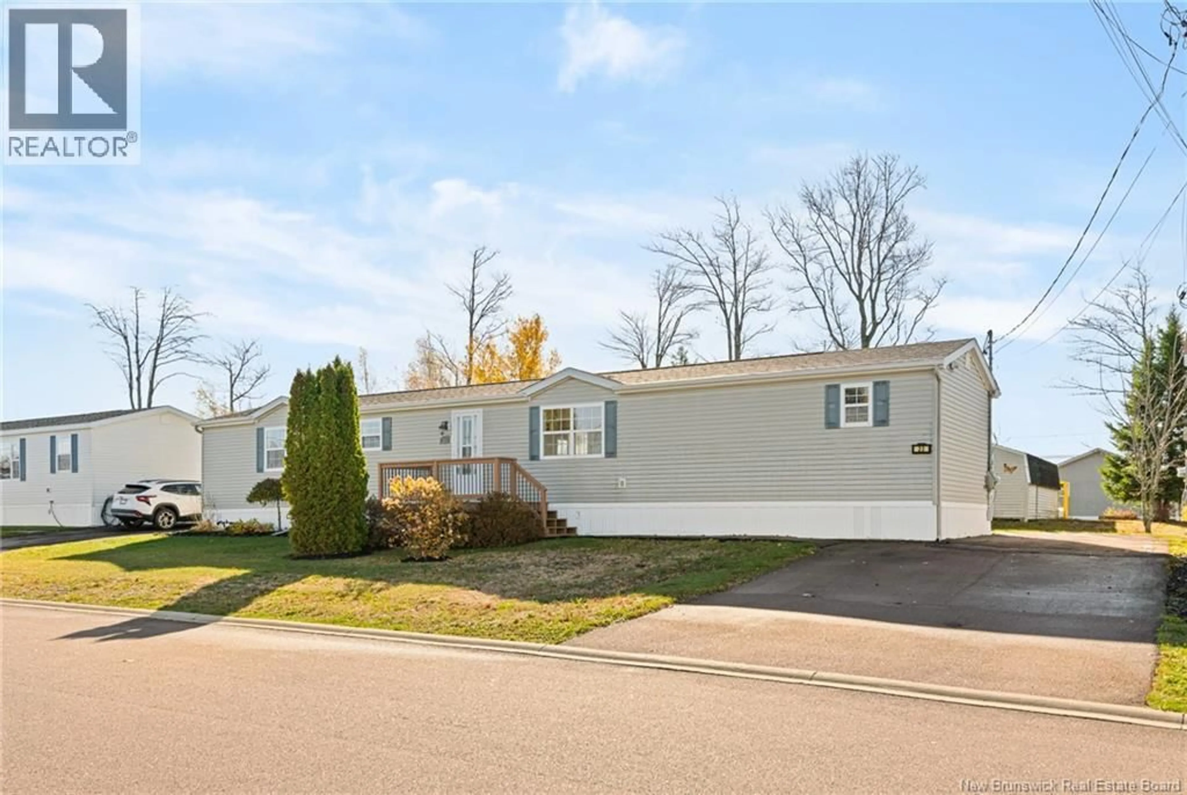 Home with vinyl exterior material, street for 23 RICHIBUCTOU LANE, Dieppe New Brunswick E1A7N1