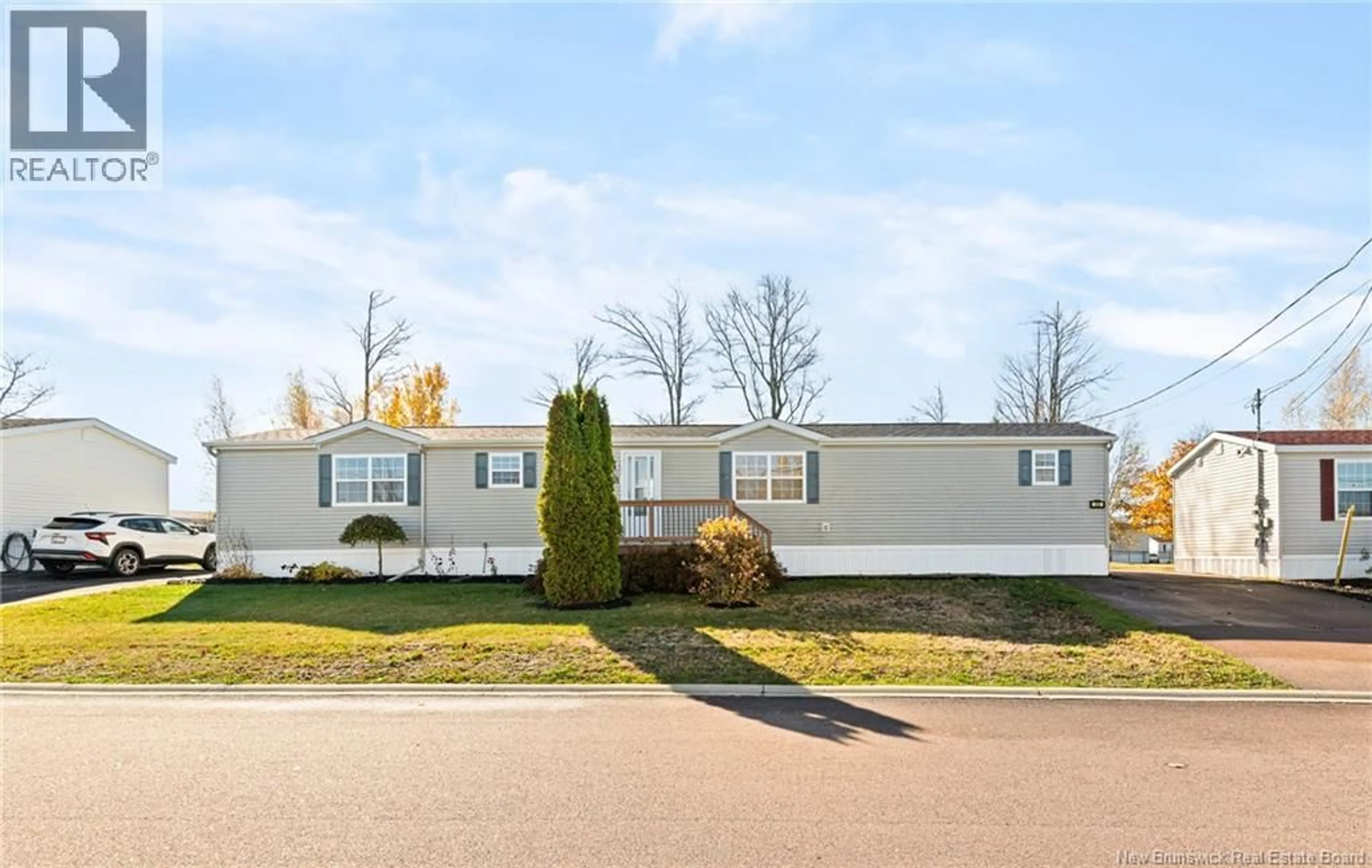 Home with vinyl exterior material, street for 23 RICHIBUCTOU LANE, Dieppe New Brunswick E1A7N1