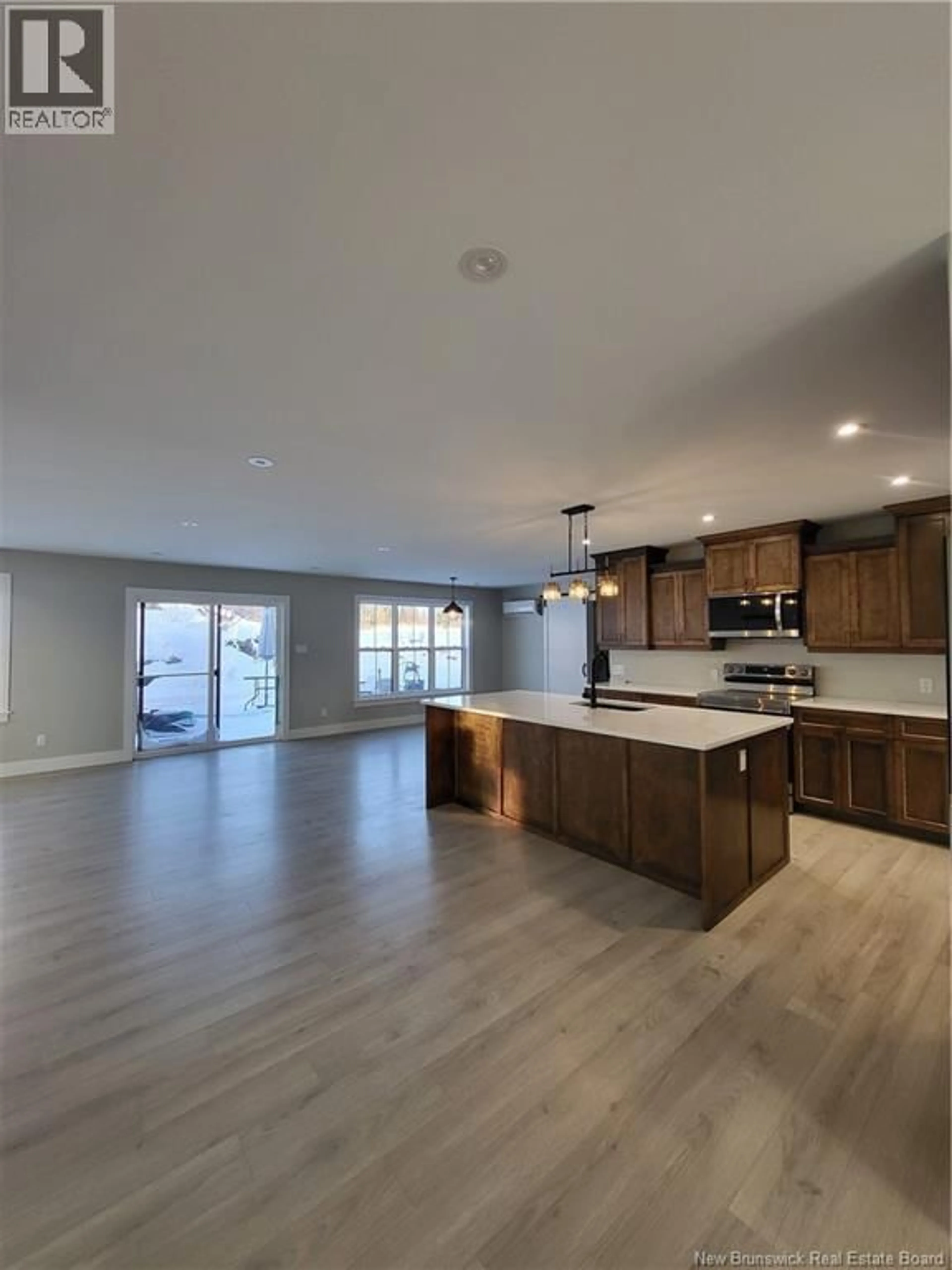 Open concept kitchen, wood/laminate floor for 20 FIELDSTONE DRIVE, Saint John New Brunswick E2J3A7