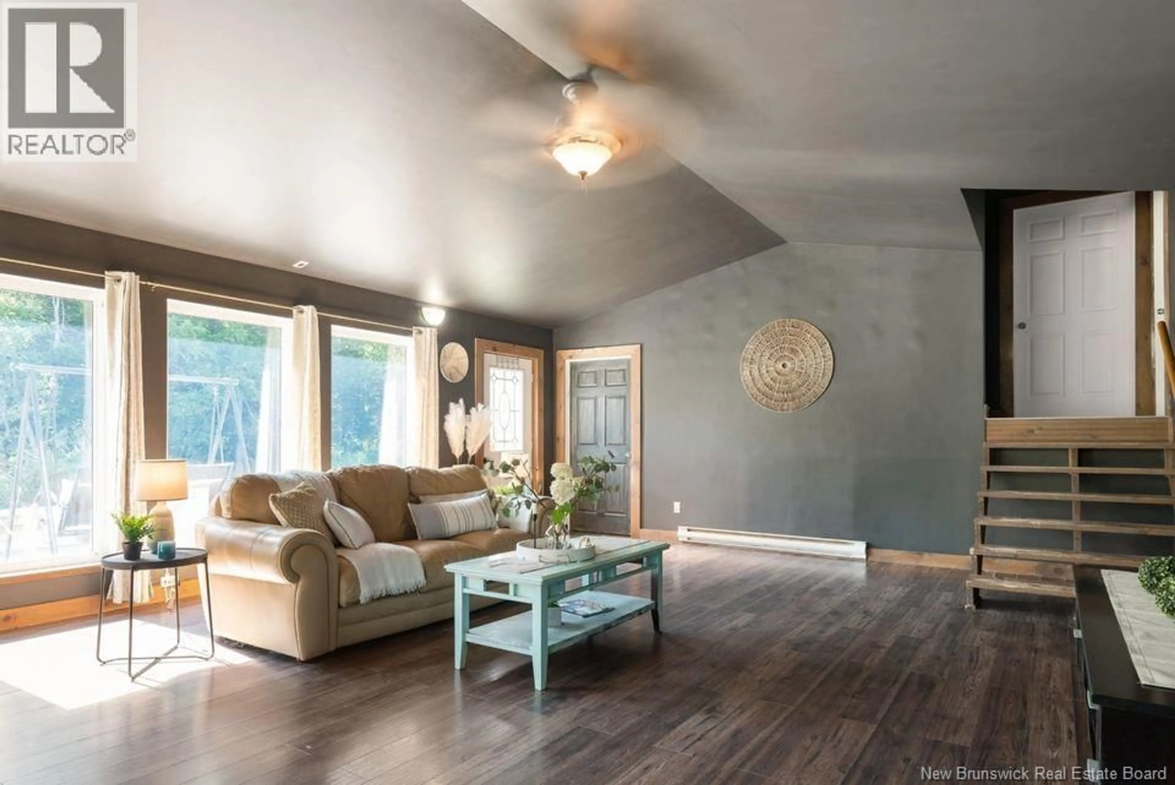 Living room with furniture, wood/laminate floor for 291 HAUT ST-ANTOINE, Sainte-Marie-De-Kent New Brunswick E4S1V6