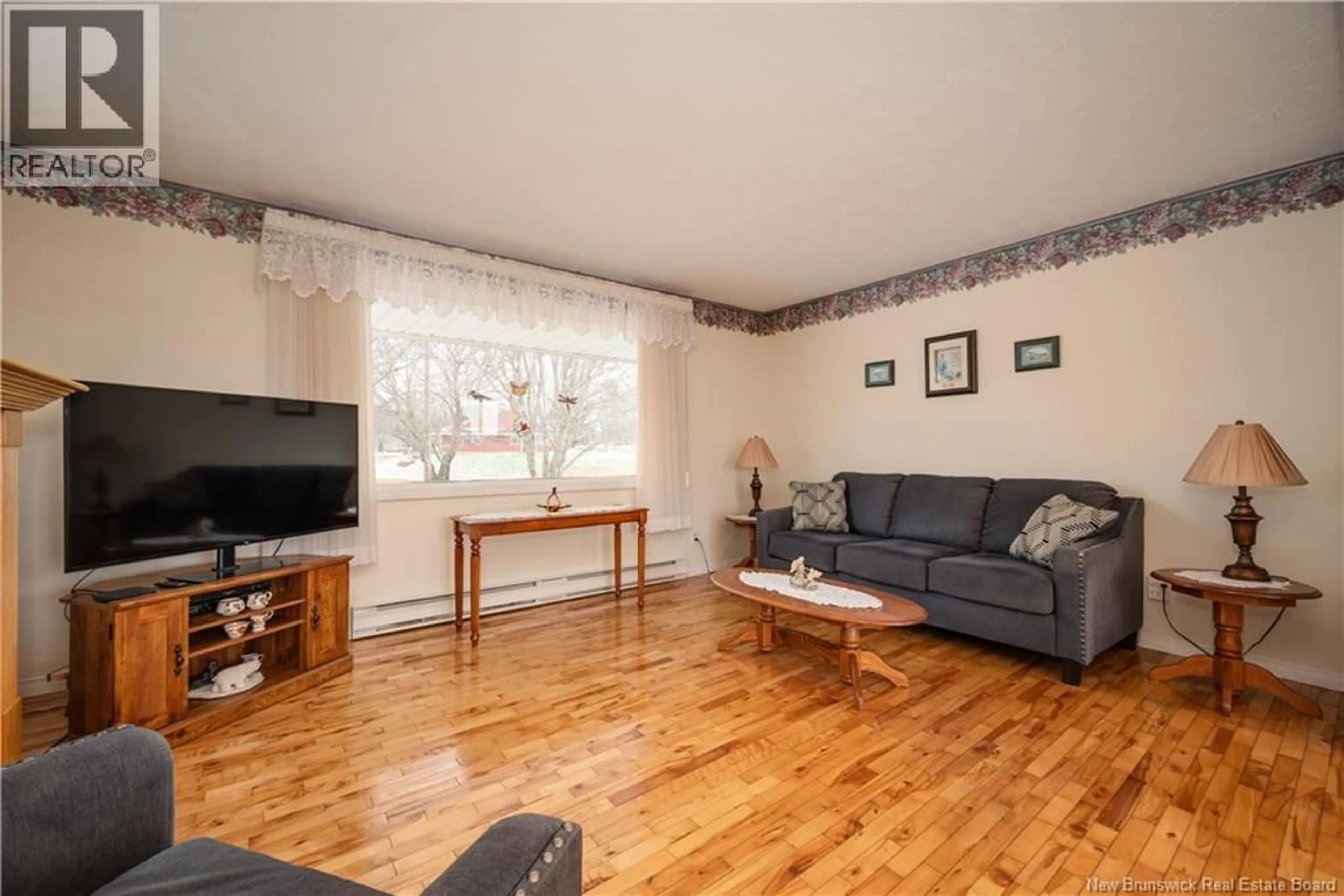 Living room with furniture, wood/laminate floor for 19 LEGION STREET, Hillsborough New Brunswick E4H2W7