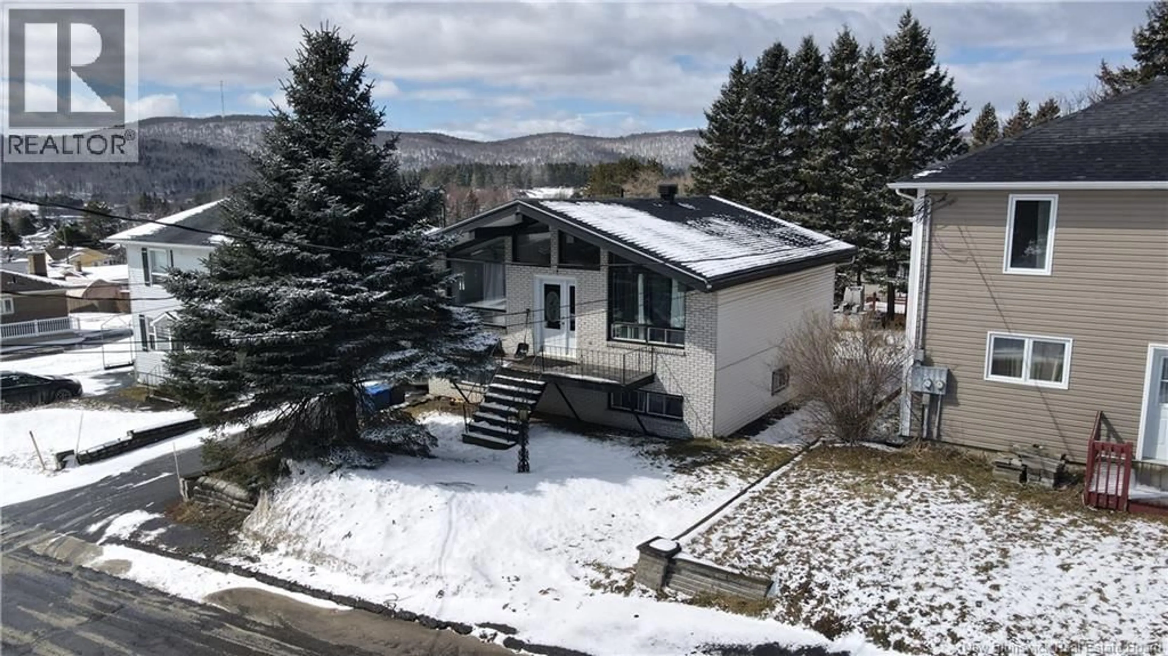 A pic from outside/outdoor area/front of a property/back of a property/a pic from drone, mountain view for 126 46TH AVENUE, Edmundston New Brunswick E3V3B6