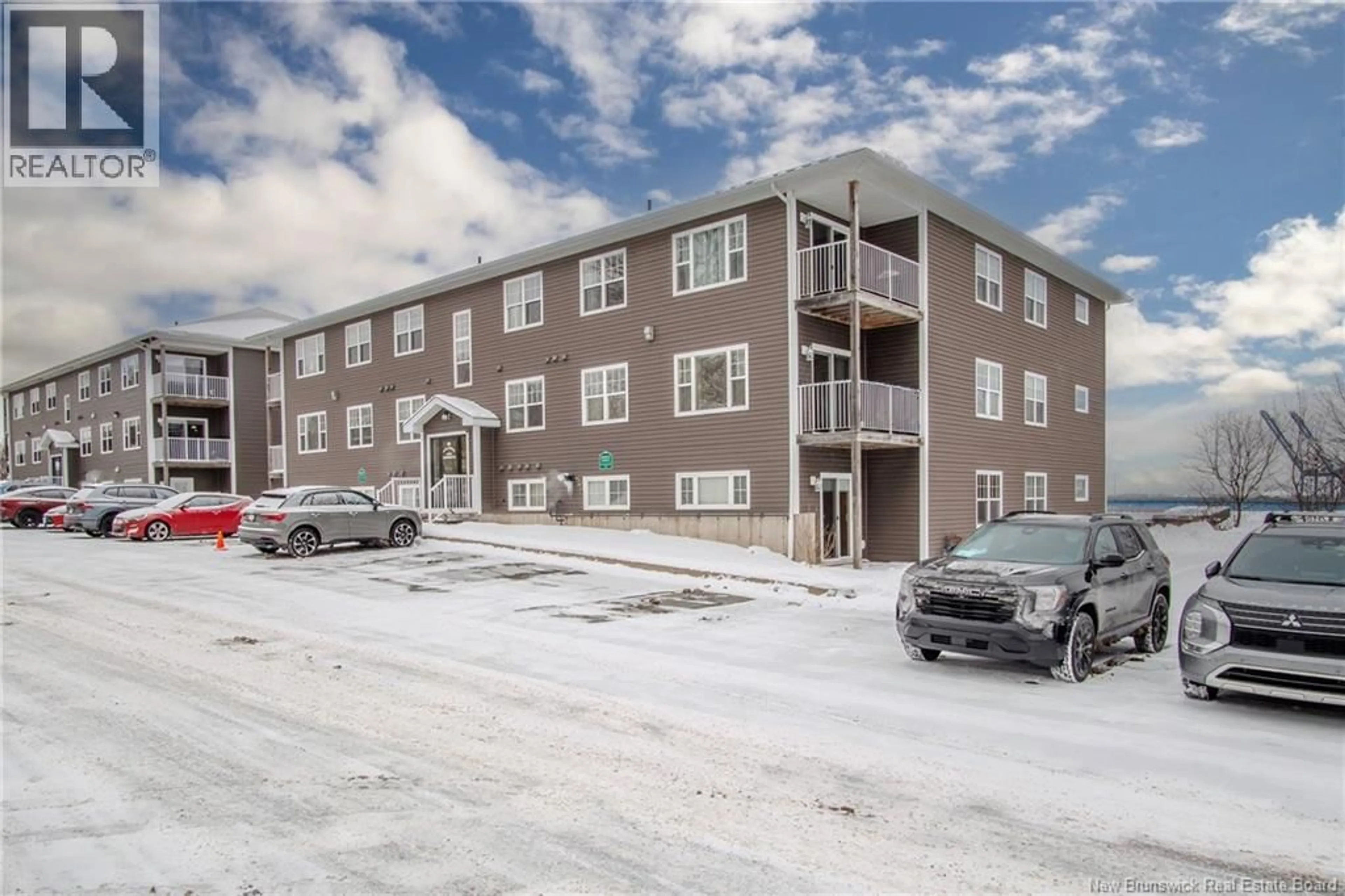 A pic from outside/outdoor area/front of a property/back of a property/a pic from drone, building for 201 - 20 KING GEORGE COURT, Saint John New Brunswick E2K0H5