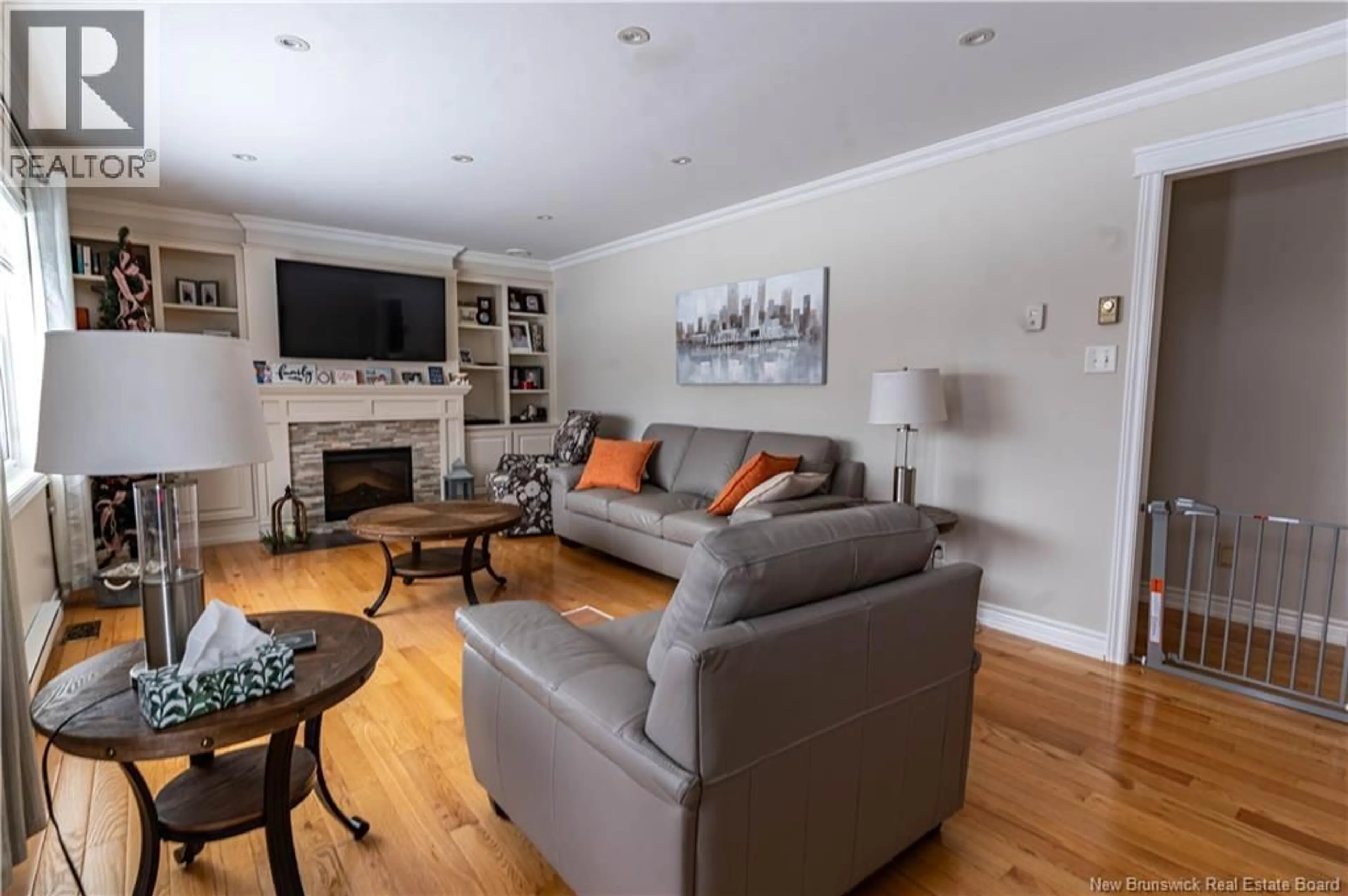 Living room with furniture, wood/laminate floor for 475L LITTLE BRANCH RD, Black River Bridge New Brunswick E1N5N2