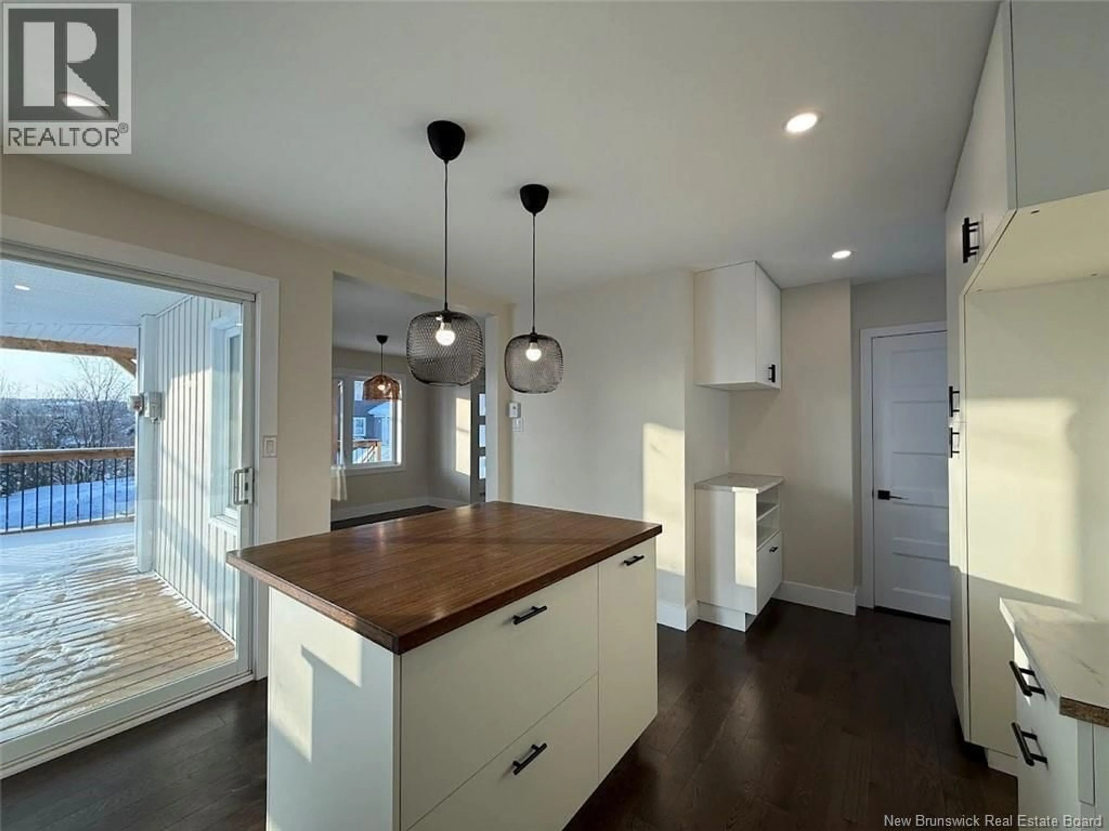 Open concept kitchen, wood/laminate floor for 17 CORMIER STREET, Edmundston New Brunswick E3V4S7