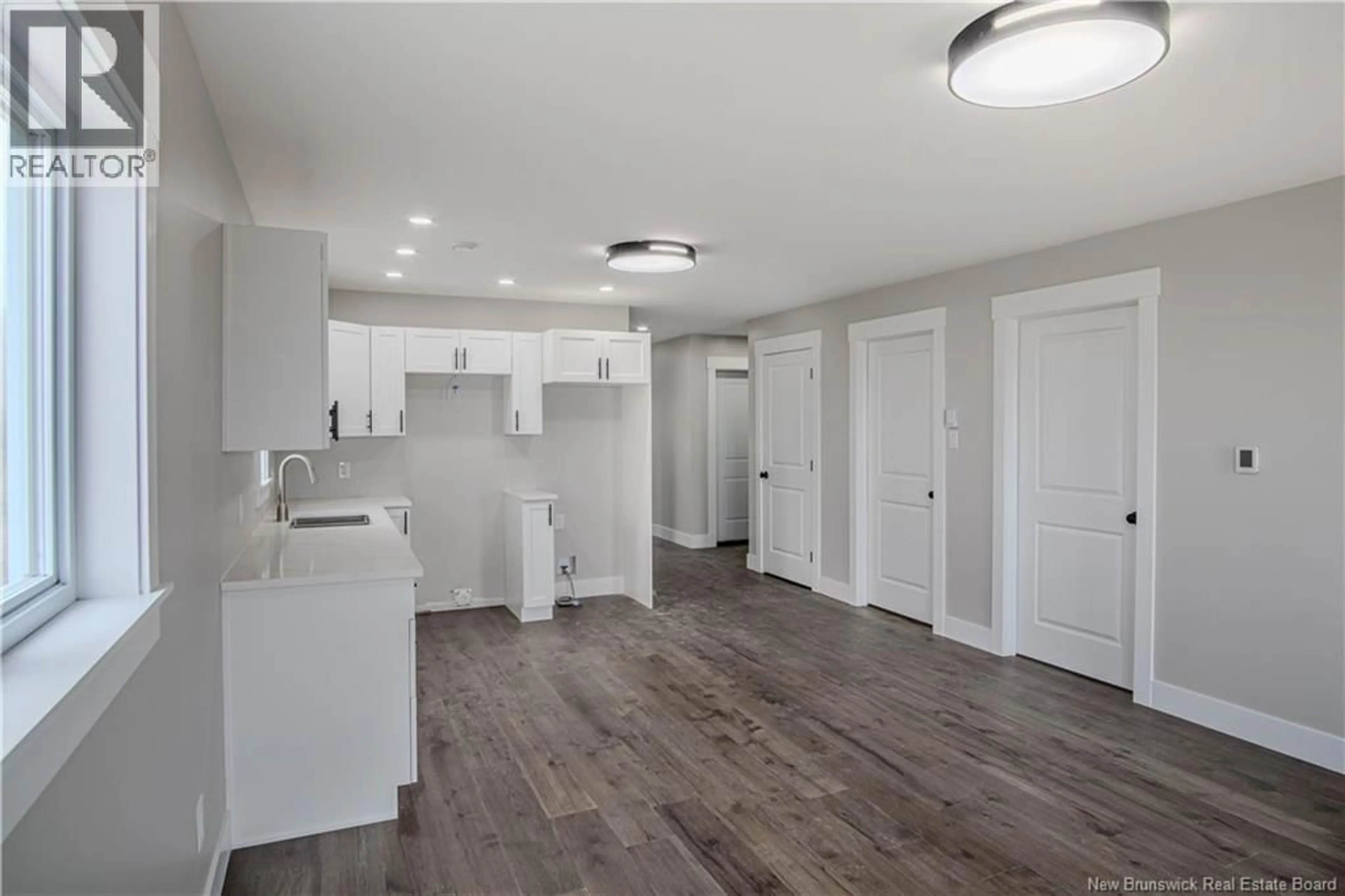 Open concept kitchen, wood/laminate floor for 47 ROCKINGSTONE DRIVE, Saint John New Brunswick E2M0E5