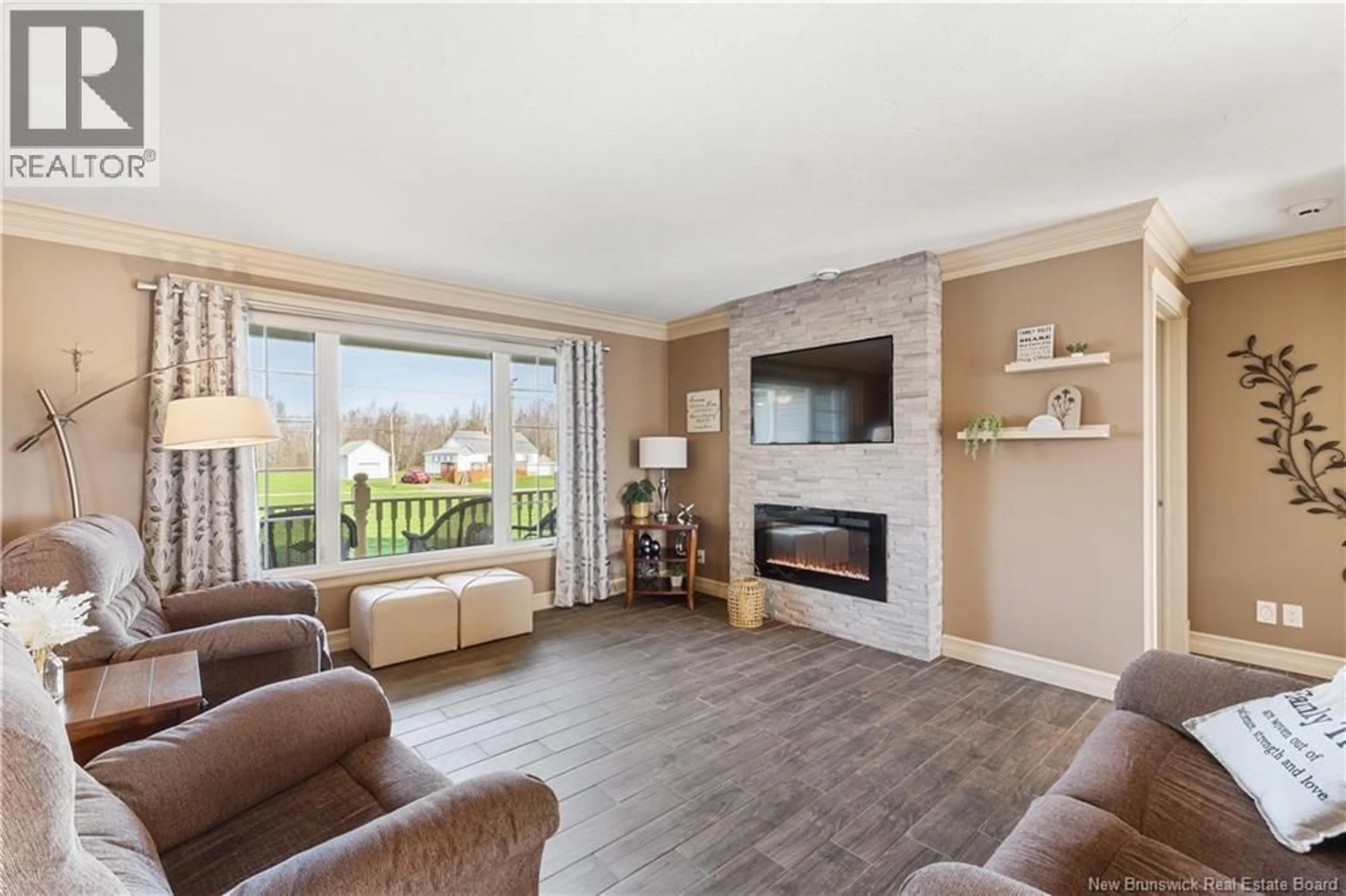 Living room with furniture, wood/laminate floor for 3042 ROUTE 132, Scoudouc New Brunswick E4P3S4