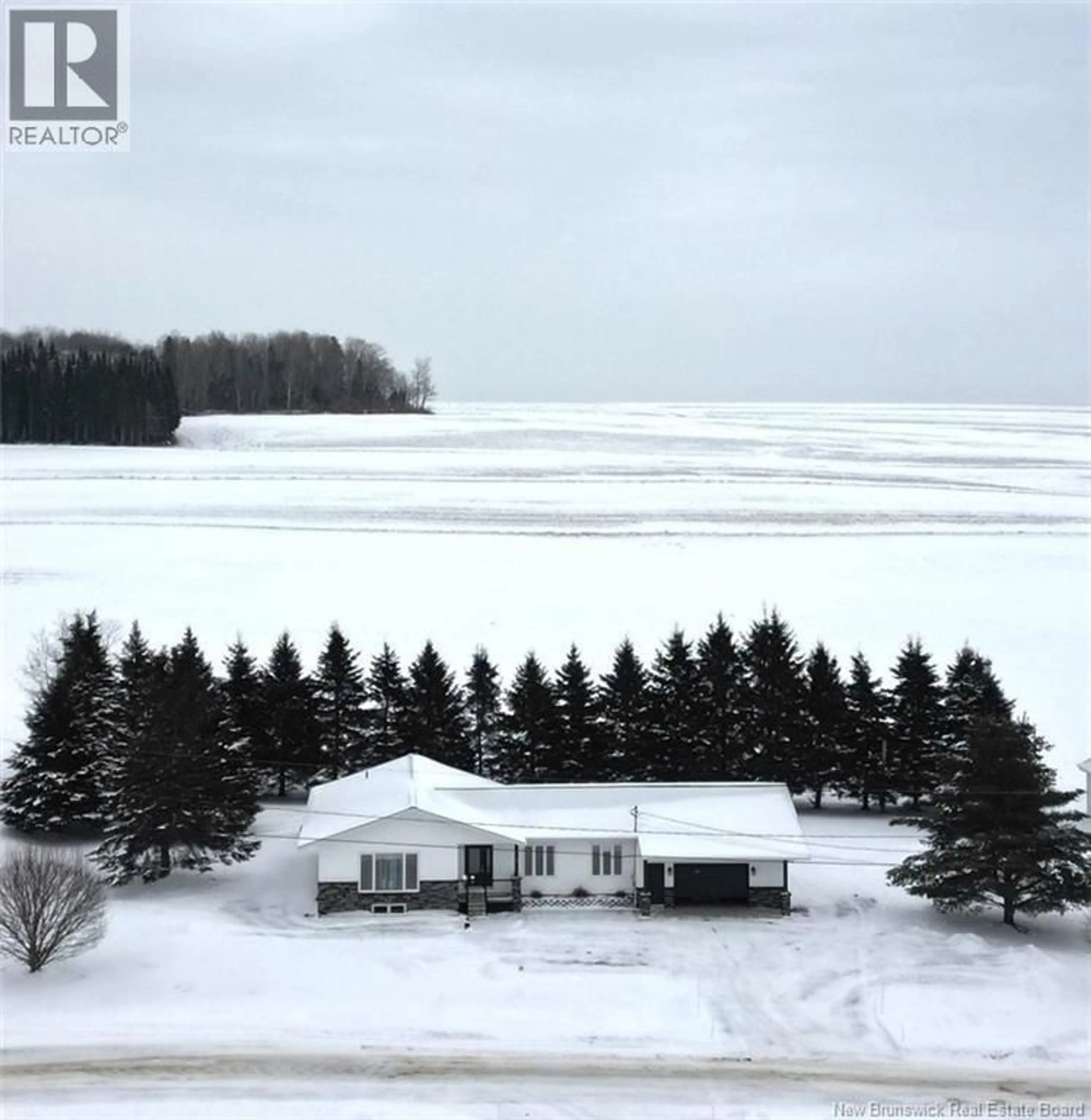 A pic from outside/outdoor area/front of a property/back of a property/a pic from drone, water/lake/river/ocean view for 19 5TH AVE, Saint-André New Brunswick E3Y3M2