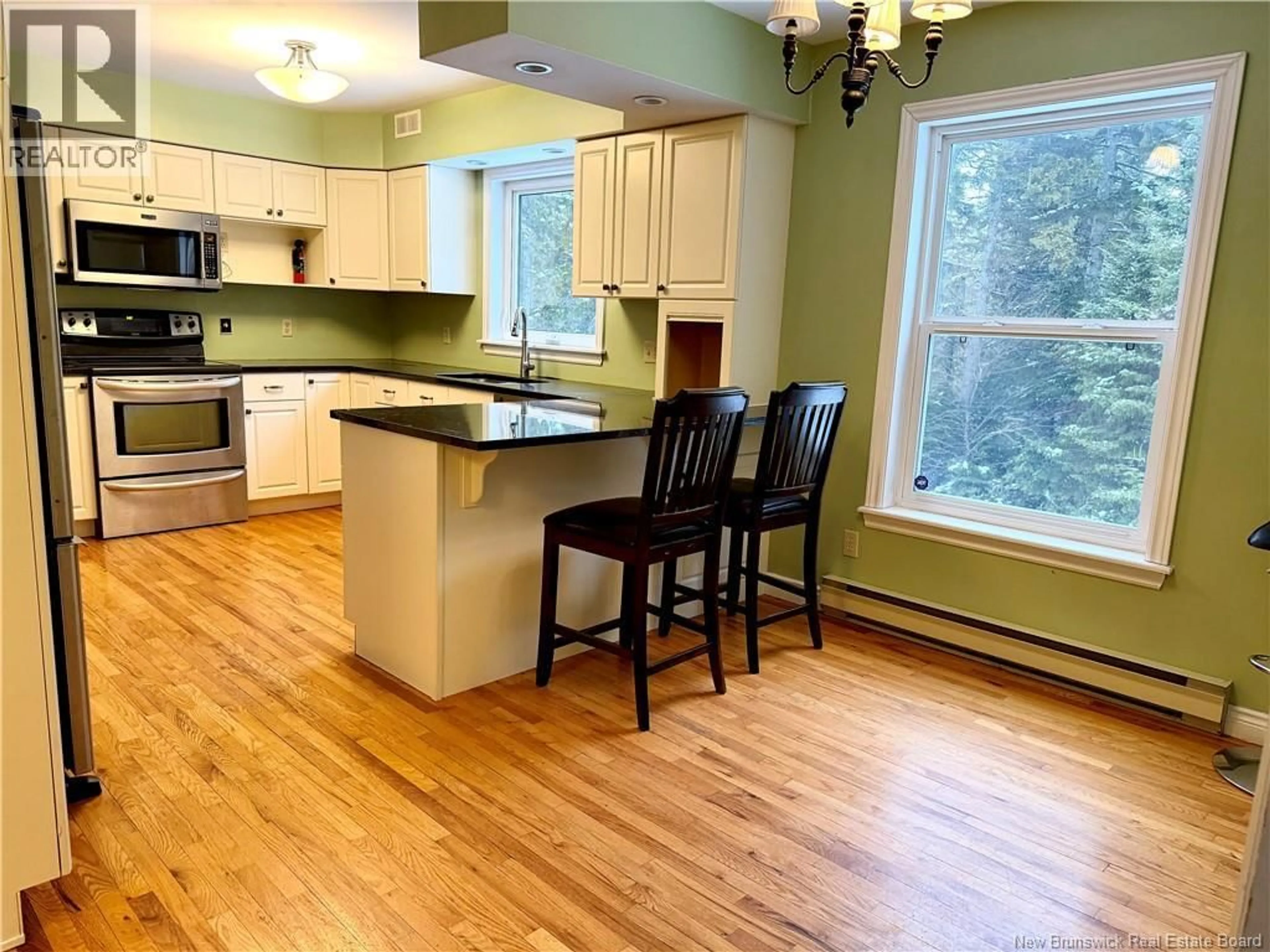 Open concept kitchen, wood/laminate floor for 9 AMBASSADOR DRIVE, Quispamsis New Brunswick E2E2W4