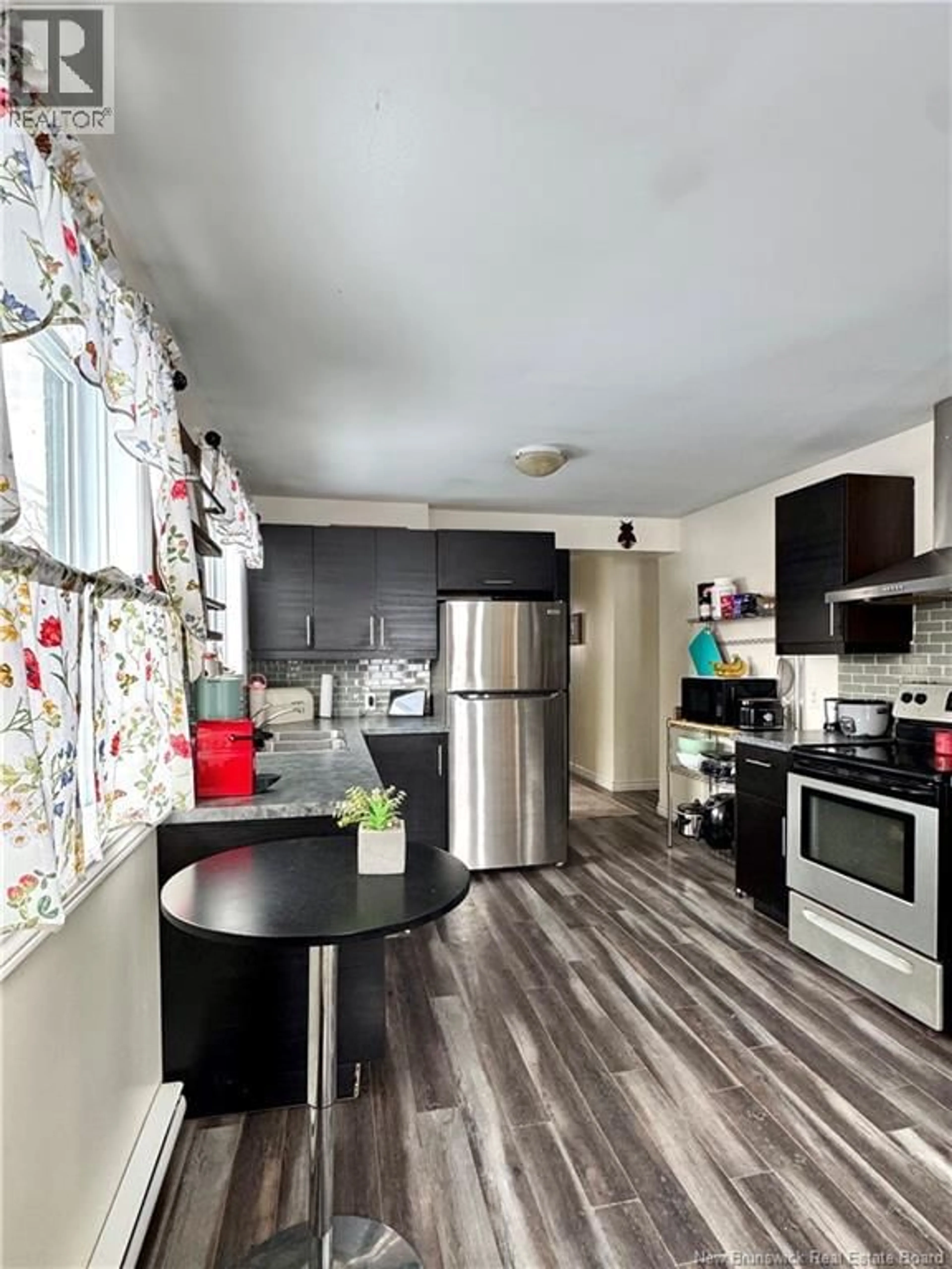 Open concept kitchen, wood/laminate floor for 156 GORDON ROAD, Miramichi New Brunswick E1N1Z4