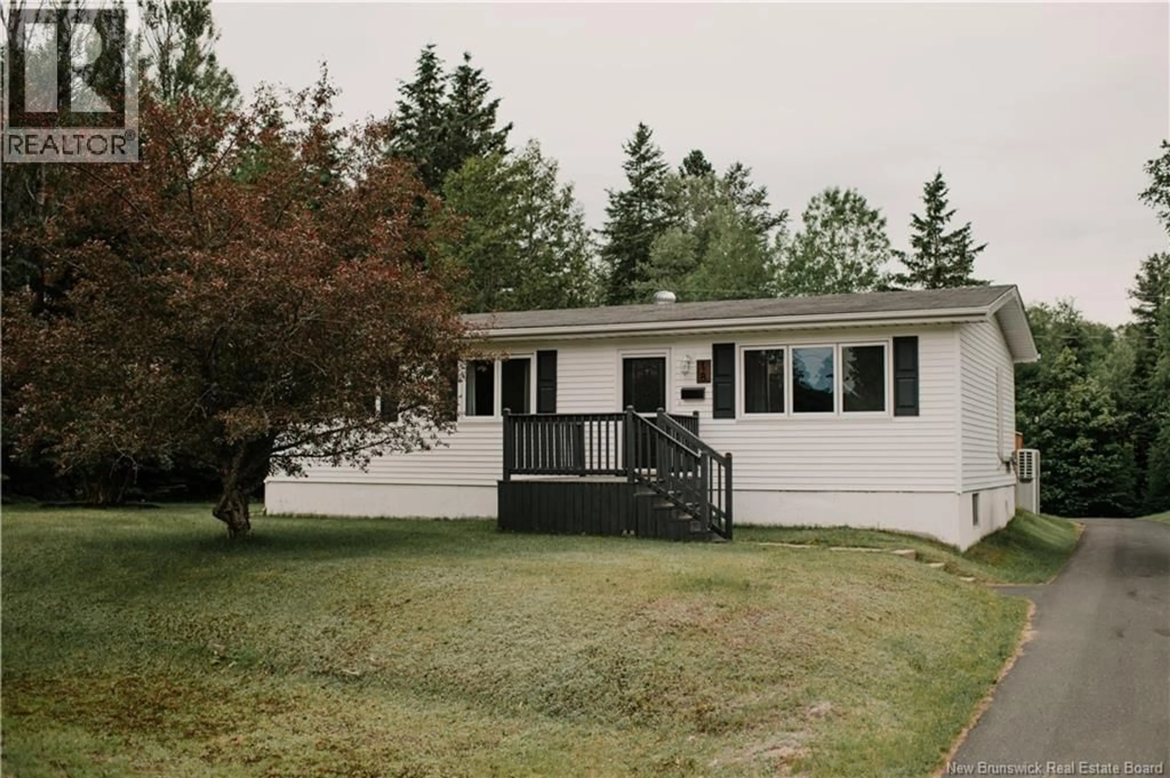 Home with vinyl exterior material, street for 18 GOLDEN HAWK DRIVE, Miramichi New Brunswick E1N3J3
