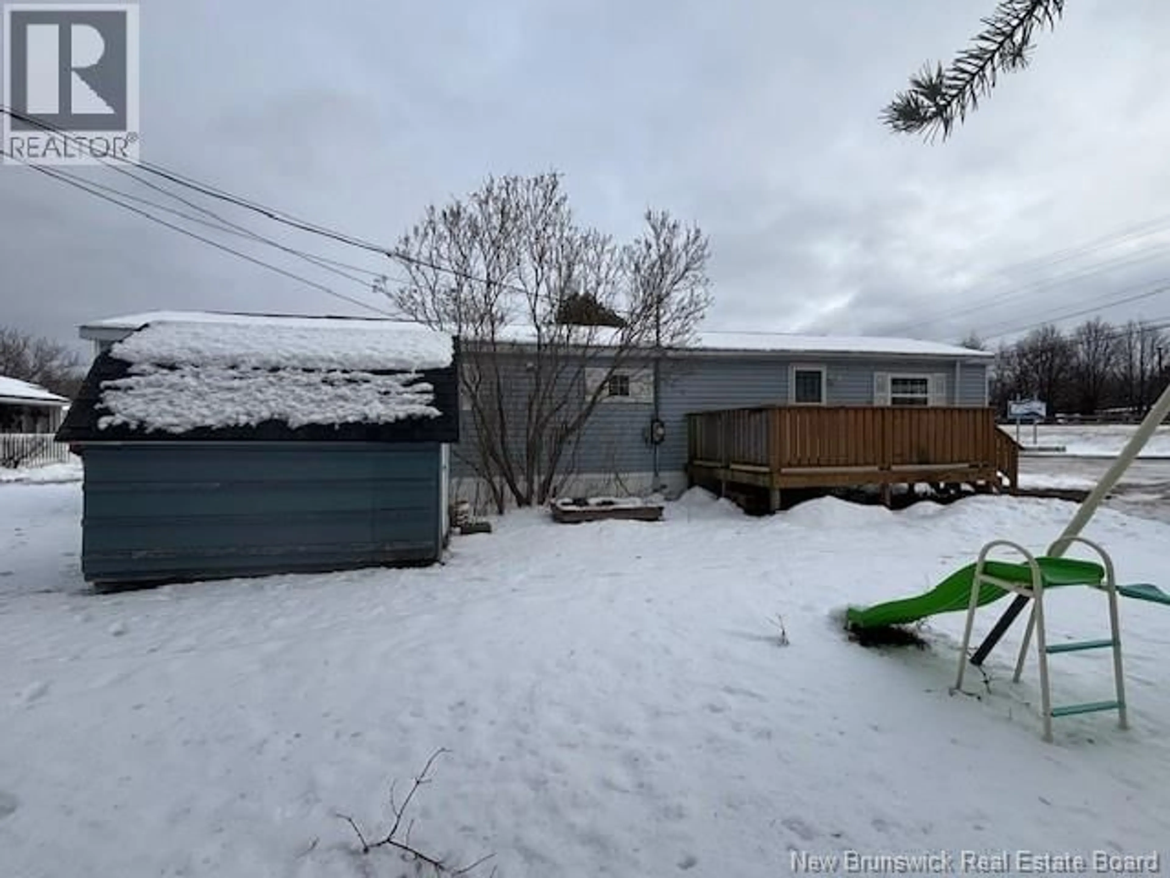 A pic from outside/outdoor area/front of a property/back of a property/a pic from drone, street for 1 FRONT STREET, Sussex Corner New Brunswick E4E2W5