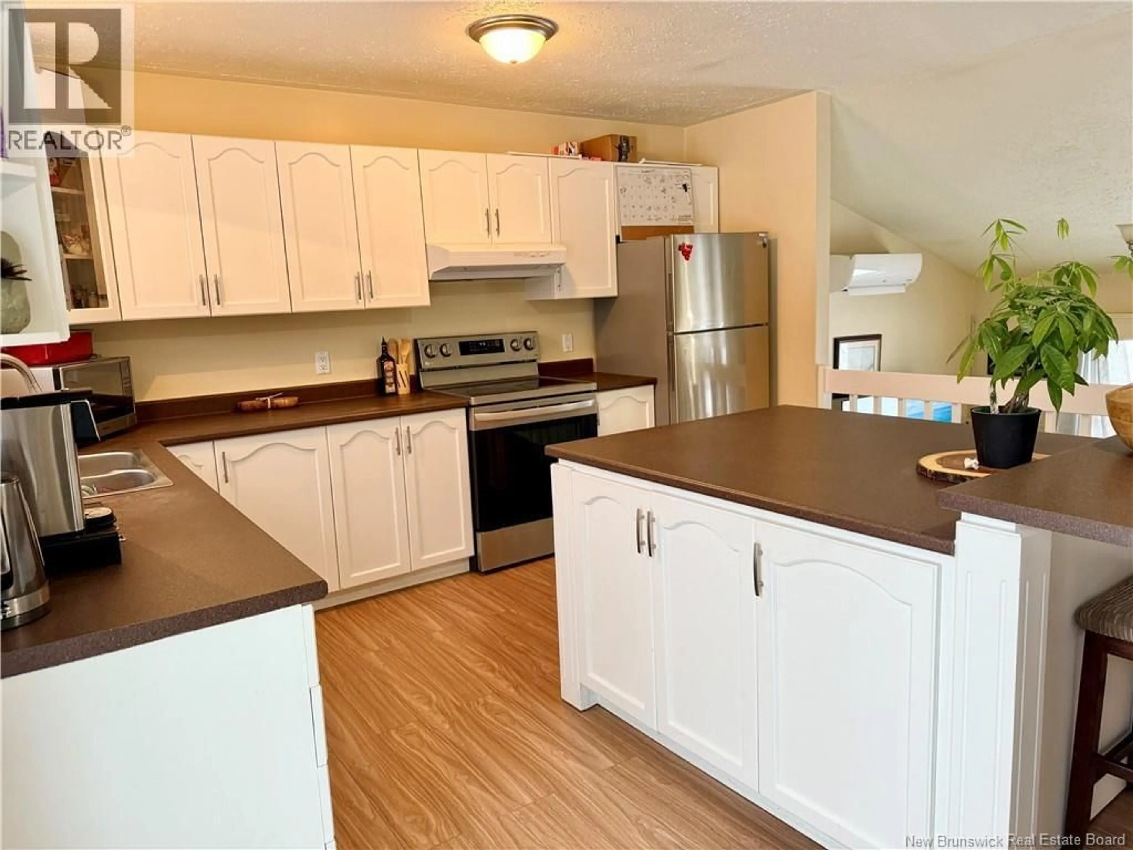 Open concept kitchen, wood/laminate floor for 132 LONGBOW, North Tetagouche New Brunswick E2A4Y7