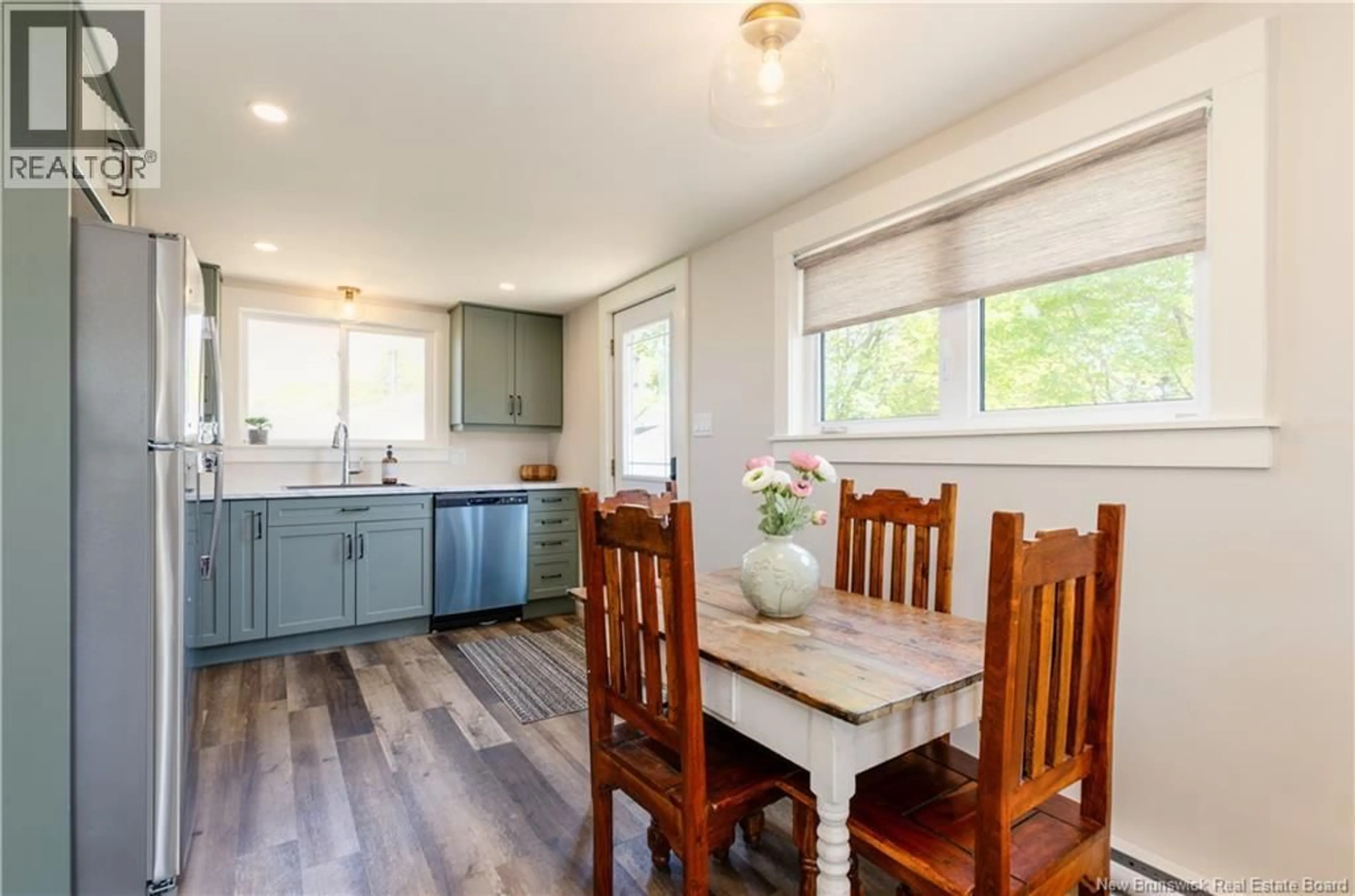 Open concept kitchen, wood/laminate floor for 25 ST JEAN BAPTISTE, Bouctouche New Brunswick E4S3W1