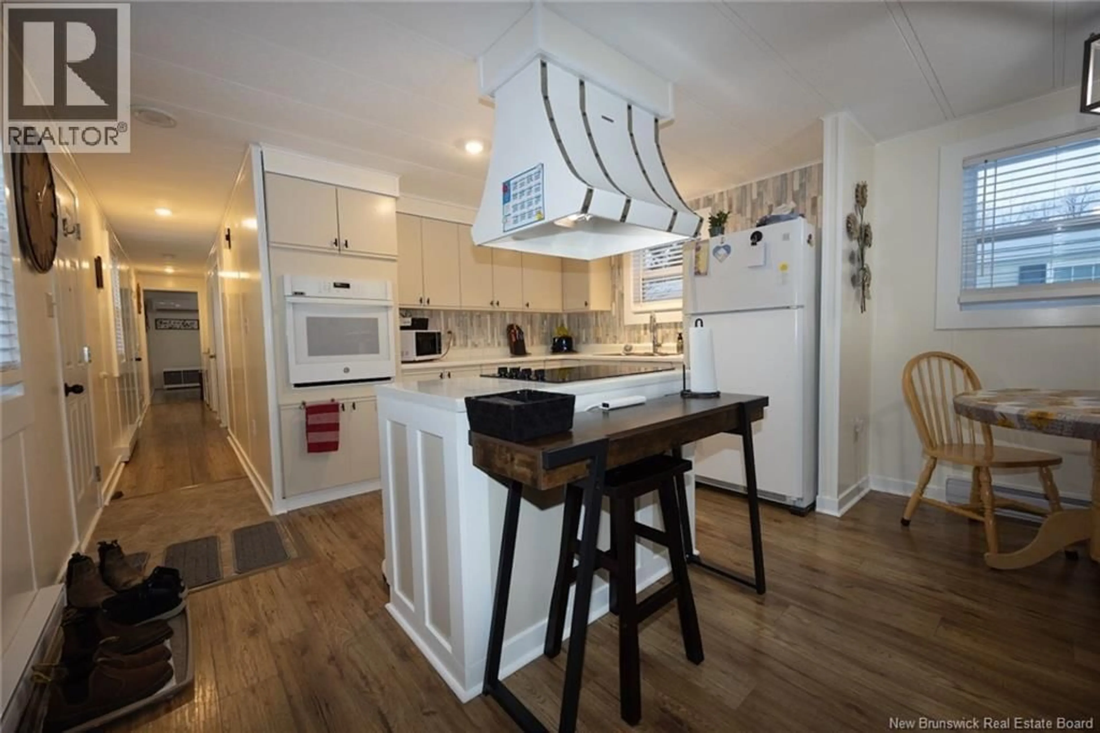 Open concept kitchen, wood/laminate floor for 431 OSMOND LANE, Fredericton New Brunswick E3B7L4