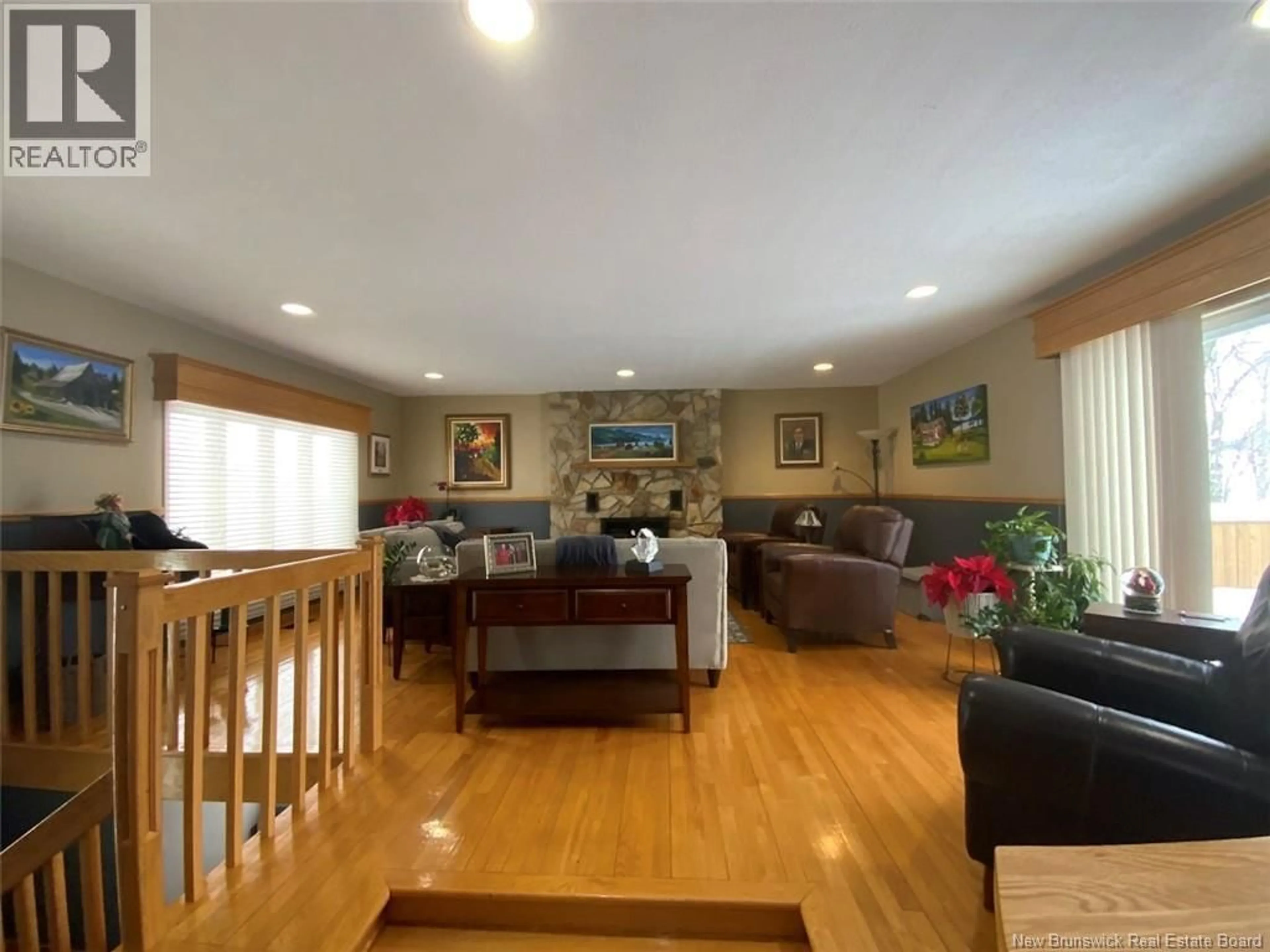 Living room with furniture, wood/laminate floor for 100 34E AVENUE, Edmundston New Brunswick E3V2T5