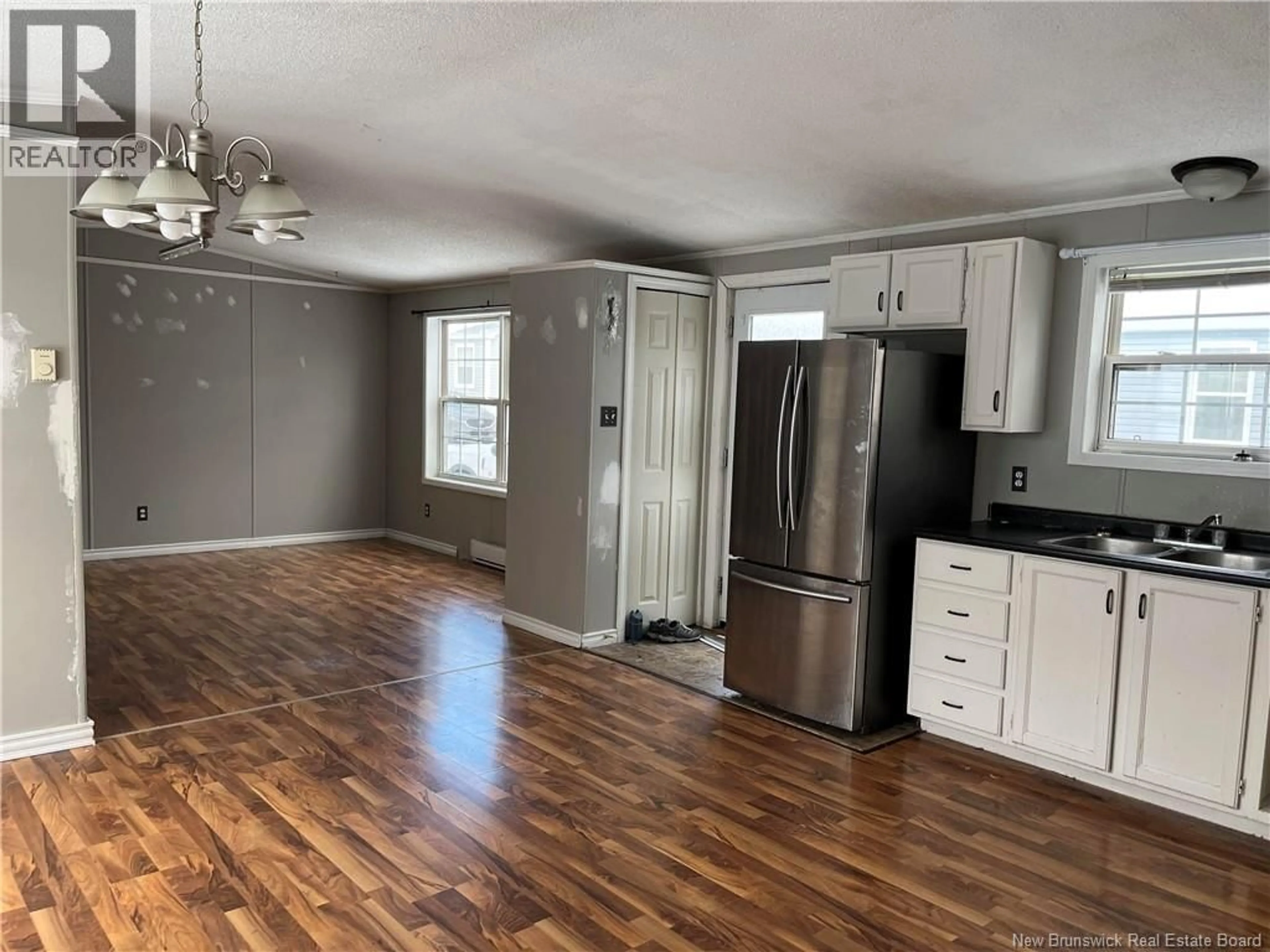 Open concept kitchen, wood/laminate floor for 45 CROWN COURT, Waasis New Brunswick E3B7H1