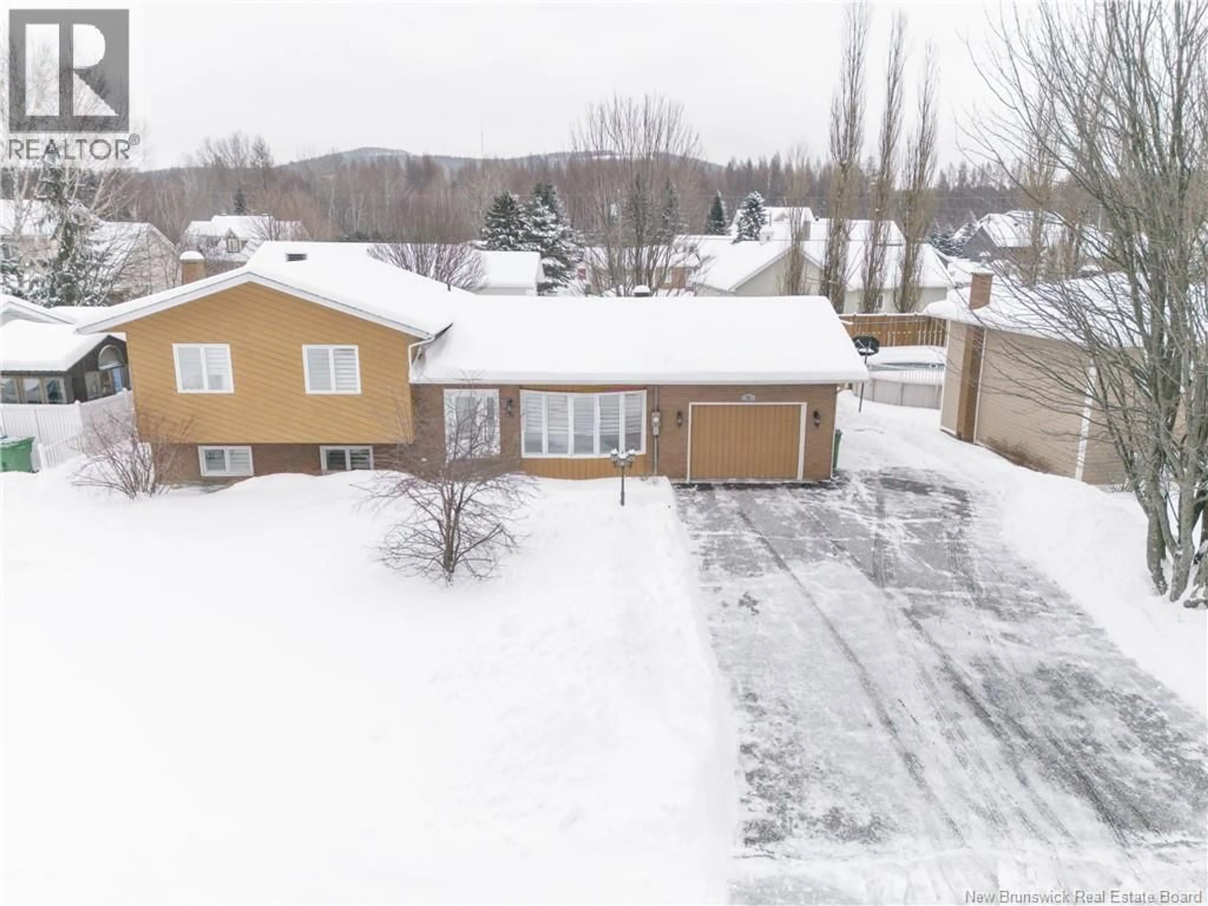 A pic from outside/outdoor area/front of a property/back of a property/a pic from drone, street for 76 LEBLOND STREET, Edmundston New Brunswick E3V4L2