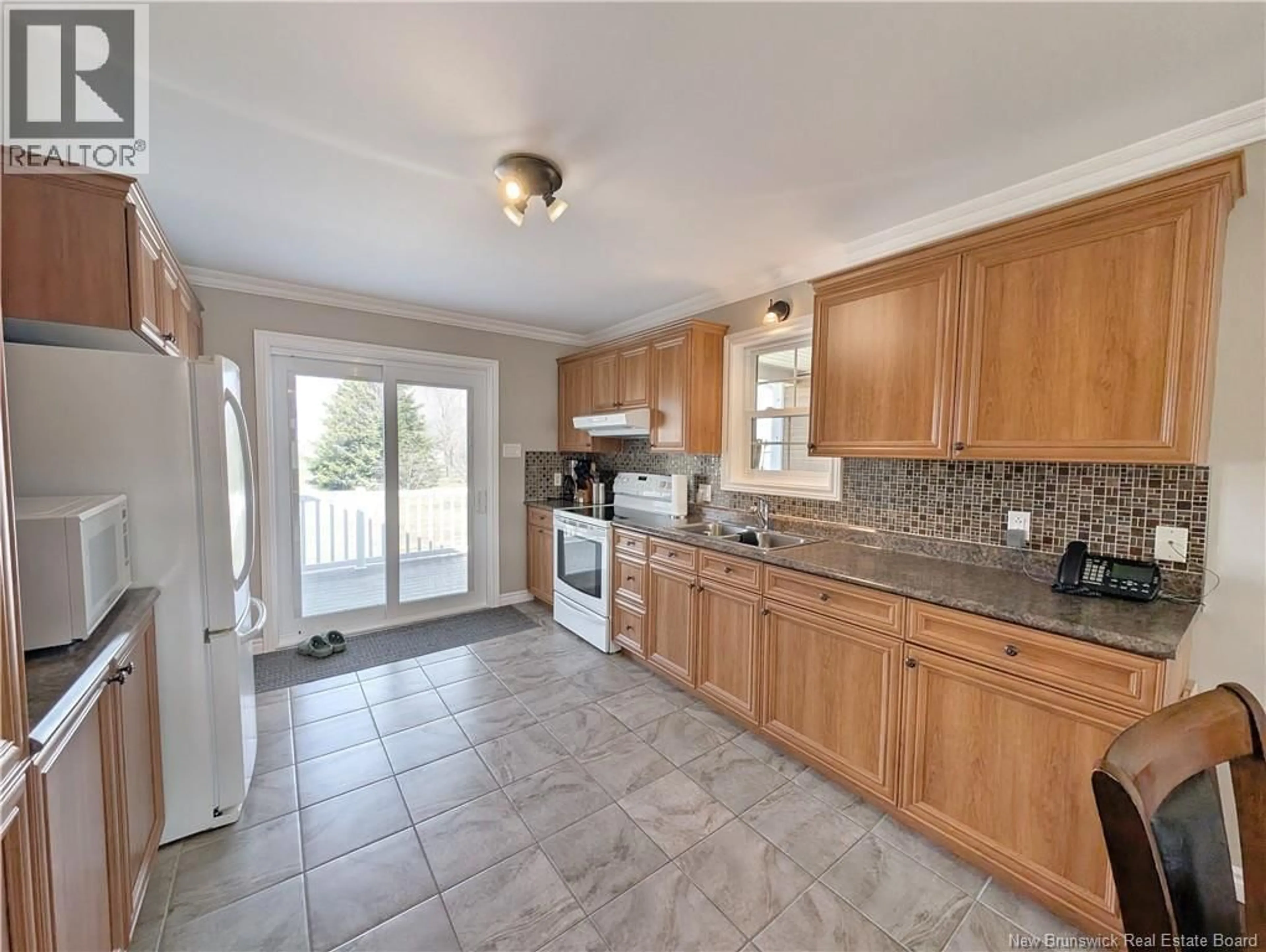 Open concept kitchen, ceramic/tile floor for 591 RUE ANTHIME, Tracadie New Brunswick E1X1A5
