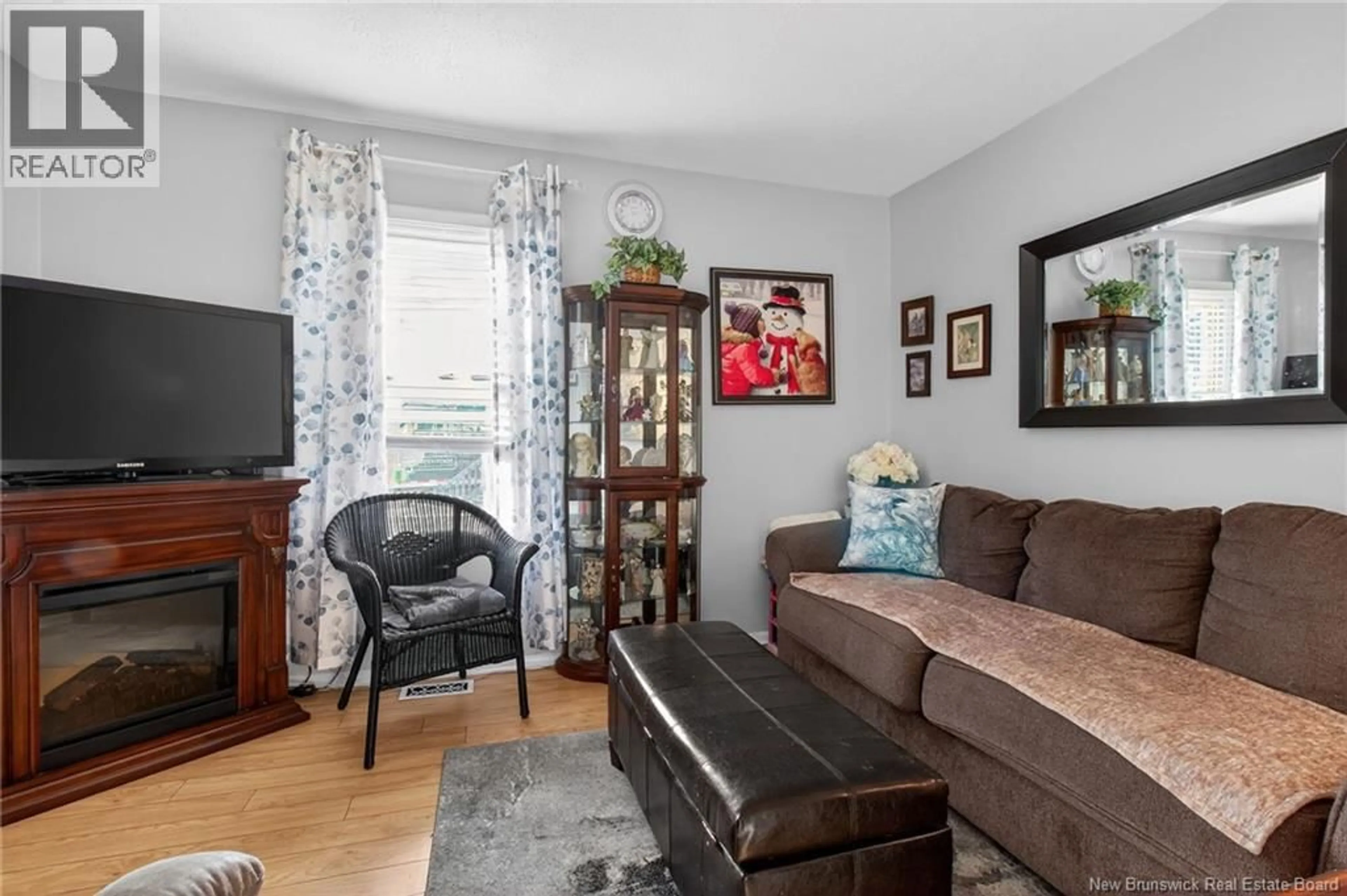 Living room with furniture, wood/laminate floor for 134 PURDY AVENUE, Moncton New Brunswick E1C7W2