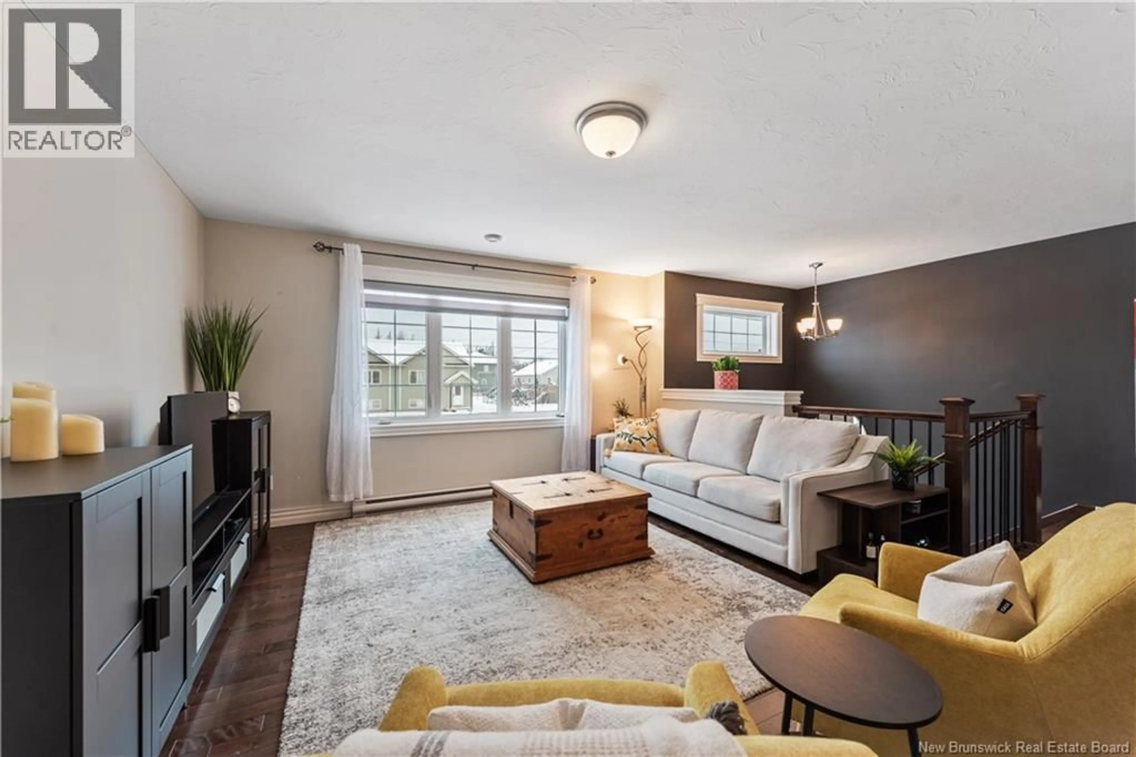 Living room with furniture, wood/laminate floor for 98 O'NEILL STREET, Moncton New Brunswick E1A9M1