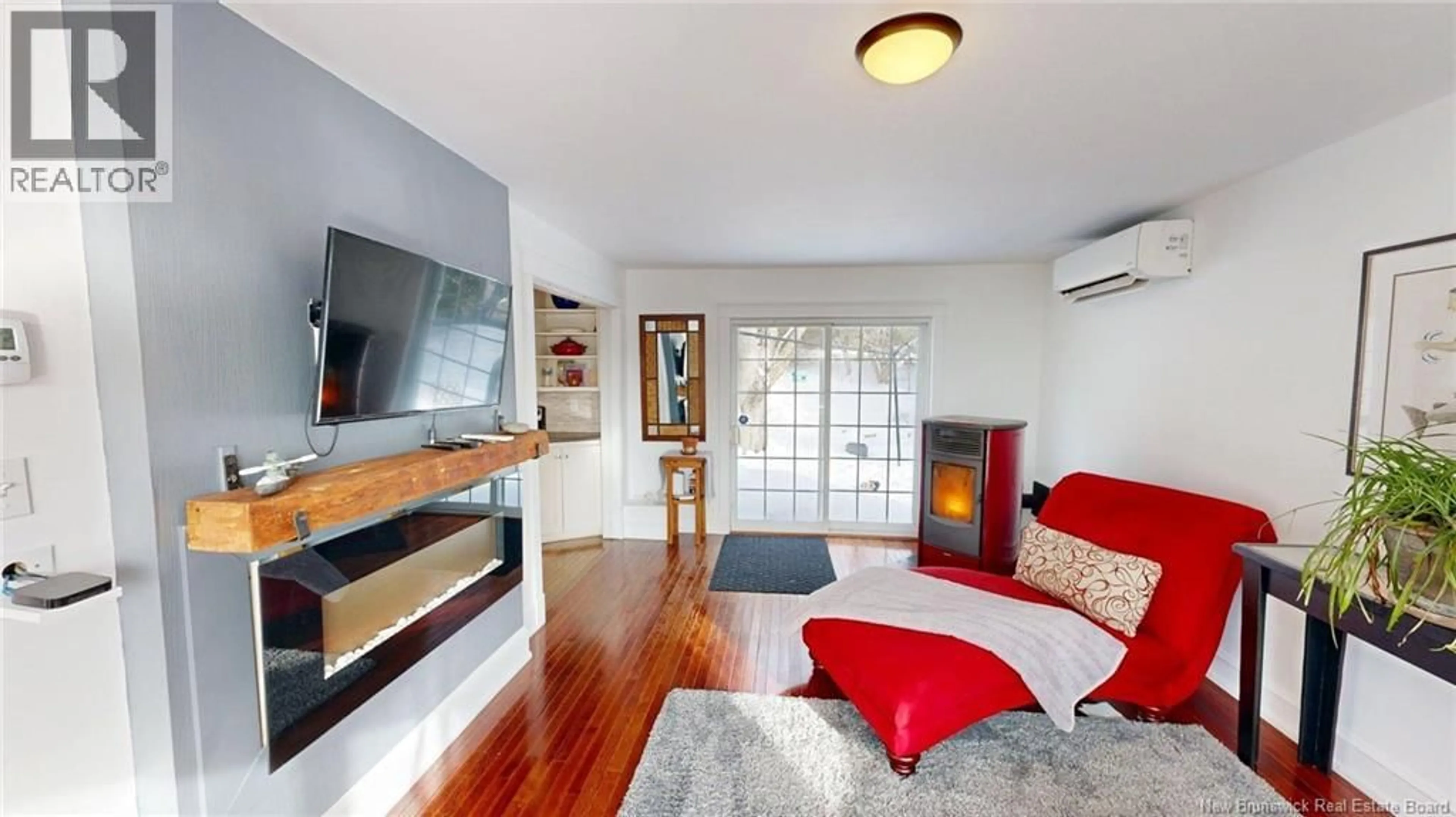 Living room with furniture, wood/laminate floor for 63 EDEN DRIVE, Rothesay New Brunswick E2H1L3