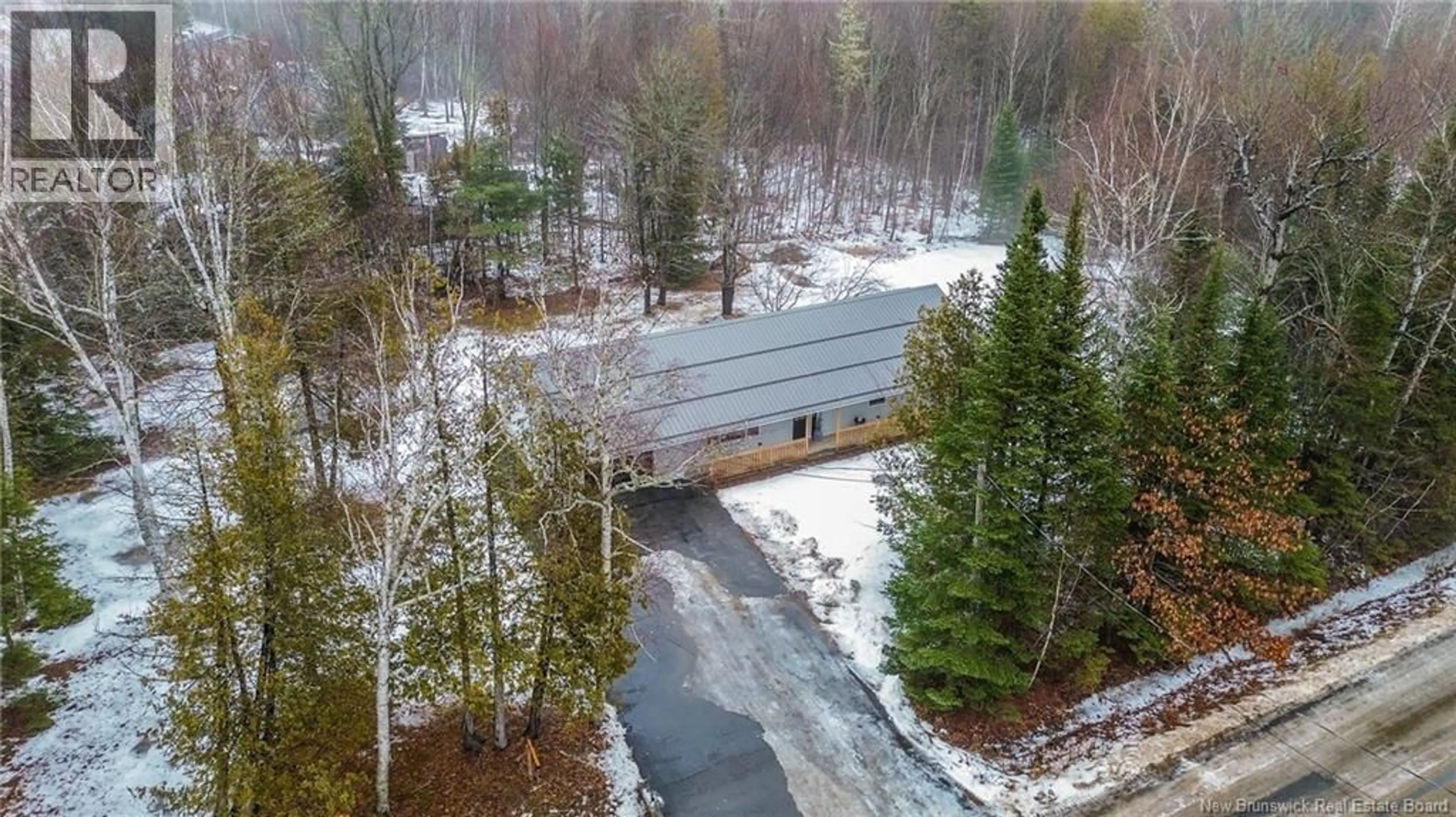 A pic from outside/outdoor area/front of a property/back of a property/a pic from drone, forest/trees view for 9 COUNTRY SQUIRE LANE, Charters Settlement New Brunswick E3C1W5