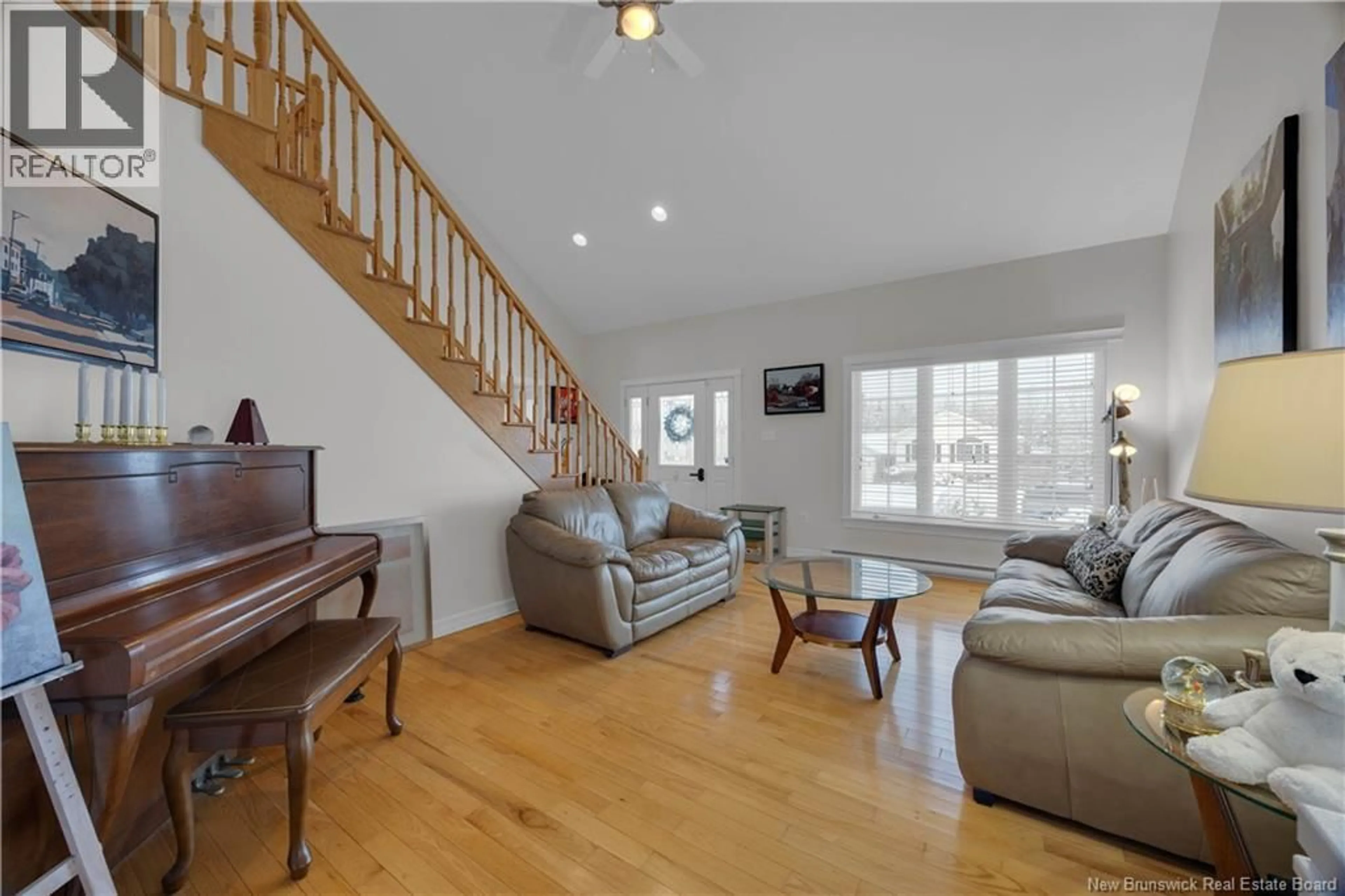 Living room with furniture, wood/laminate floor for 20 TARAWOOD LANE, Quispamsis New Brunswick E2E5Z3