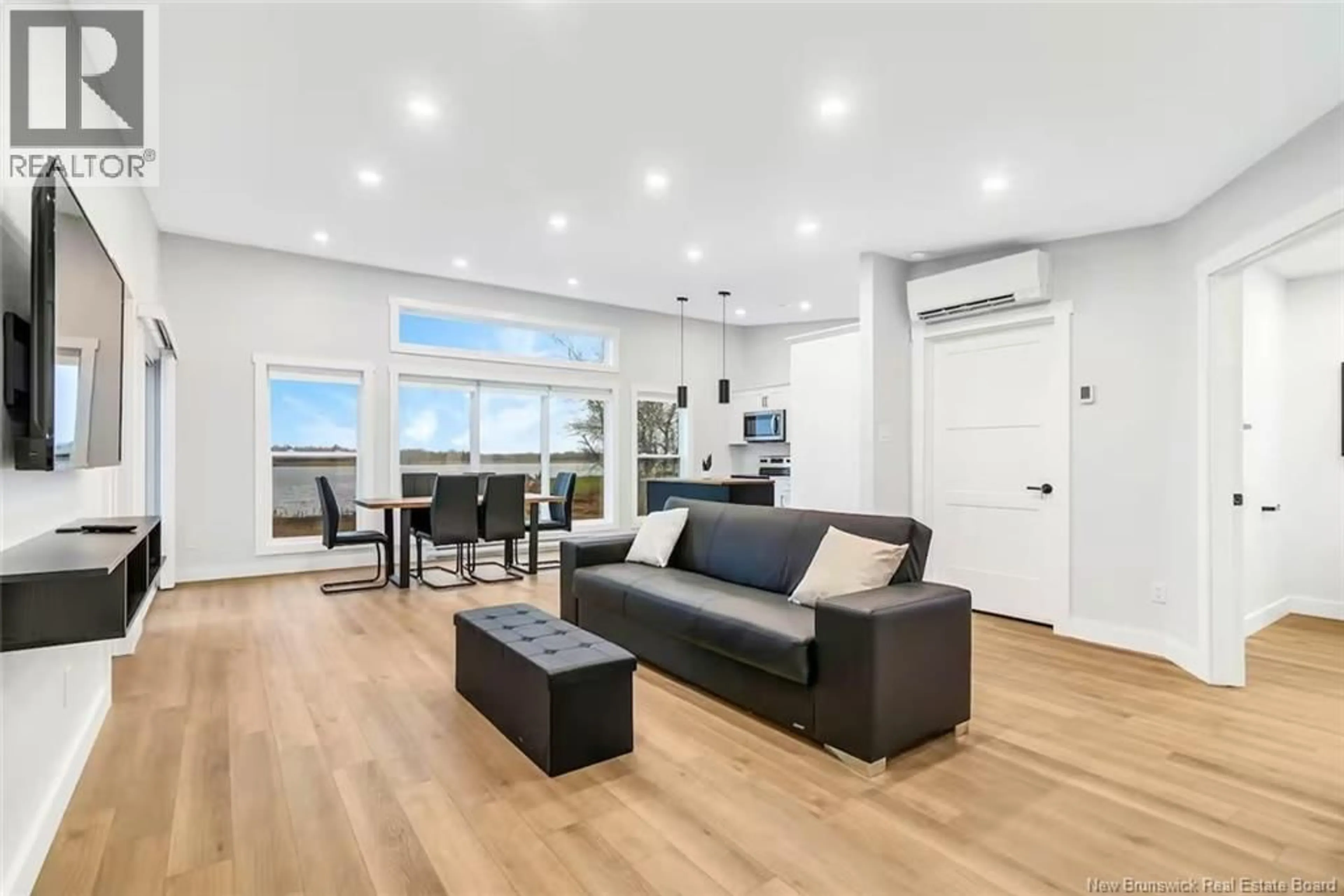 Living room with furniture, wood/laminate floor for 97 YORK, Richibucto New Brunswick E4W4K2