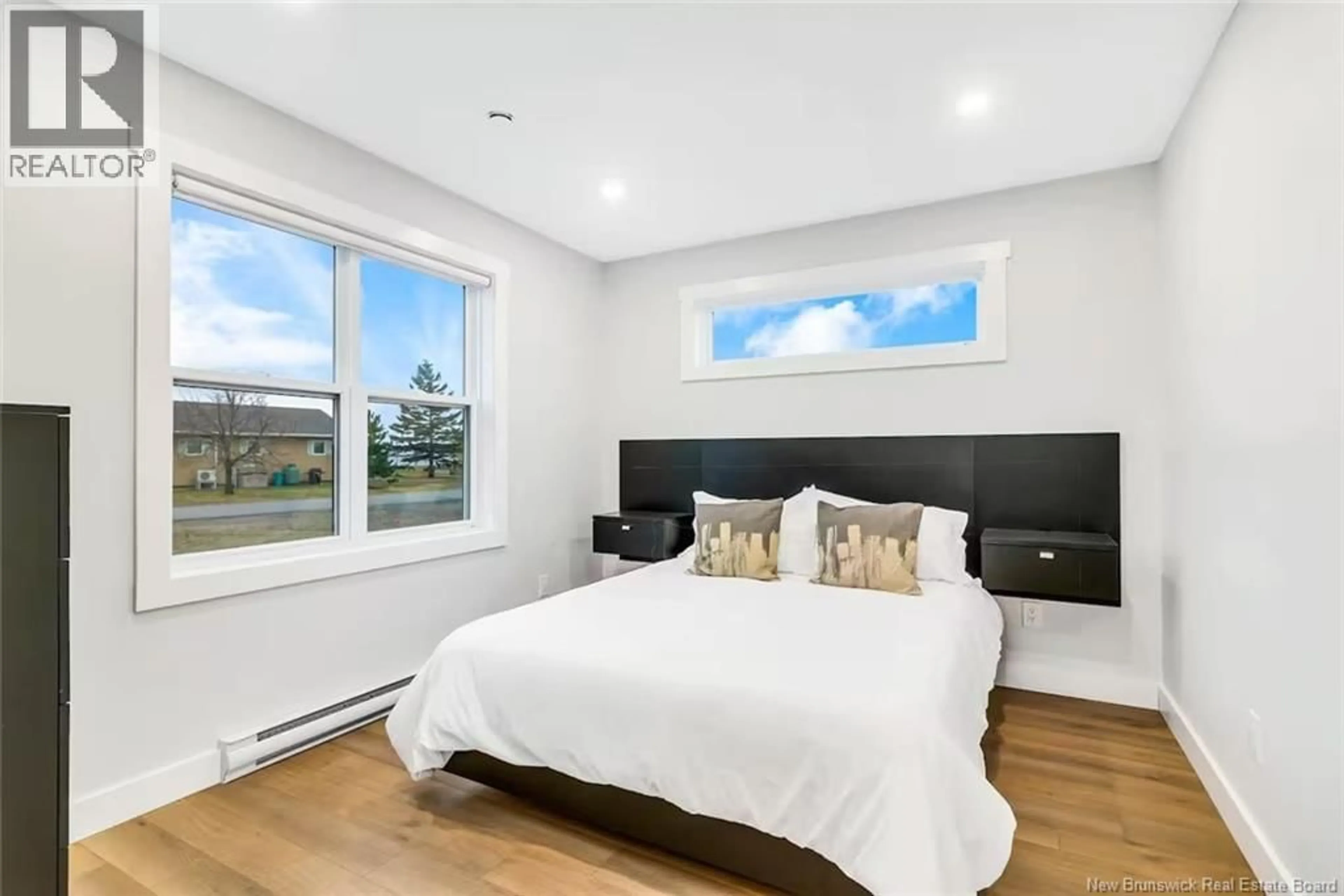 Bedroom with bed, wood/laminate floor for 97 YORK, Richibucto New Brunswick E4W4K2