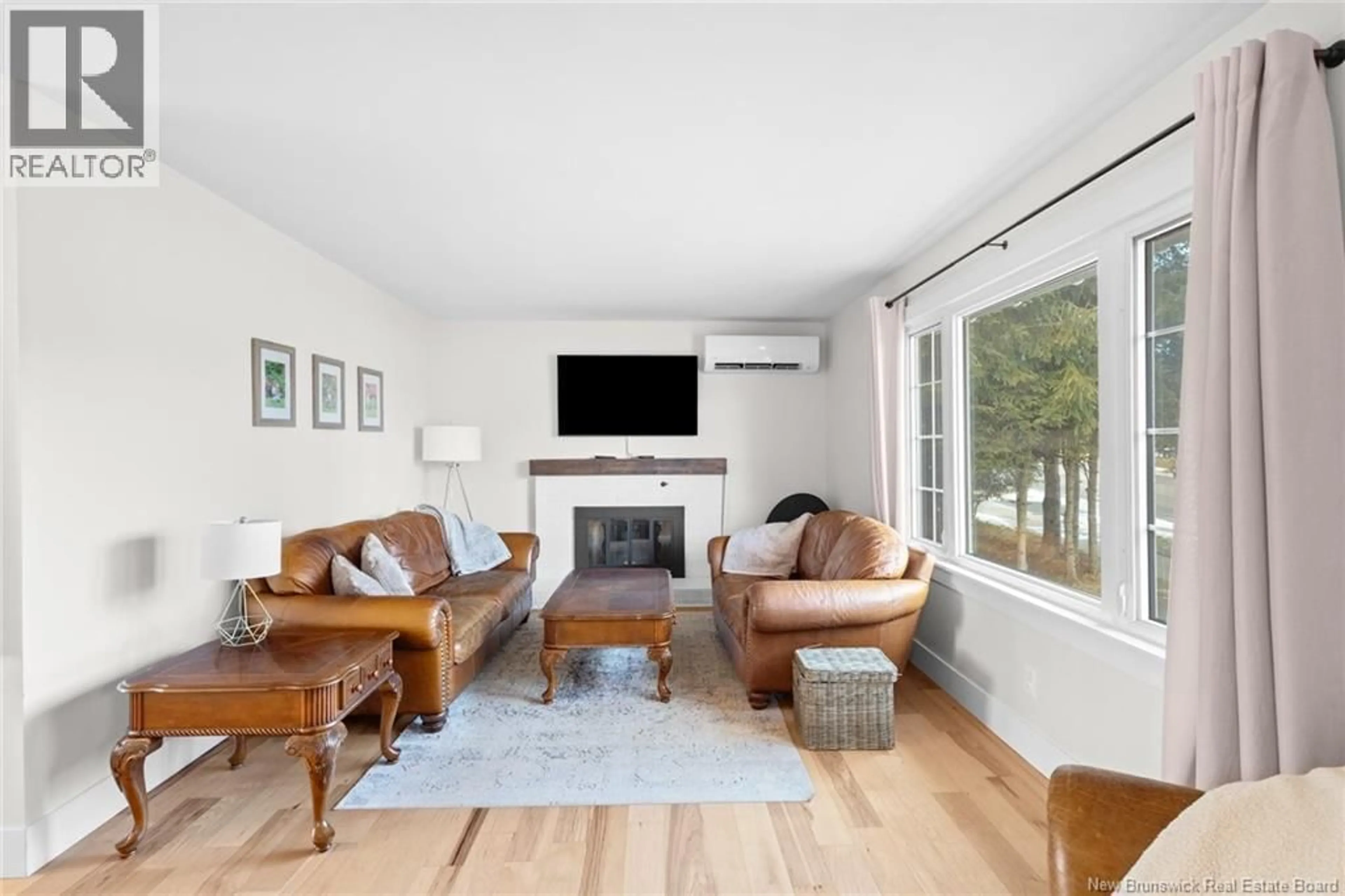 Living room with furniture, wood/laminate floor for 154 LIMERICK ROAD, Fredericton New Brunswick E3B5K4