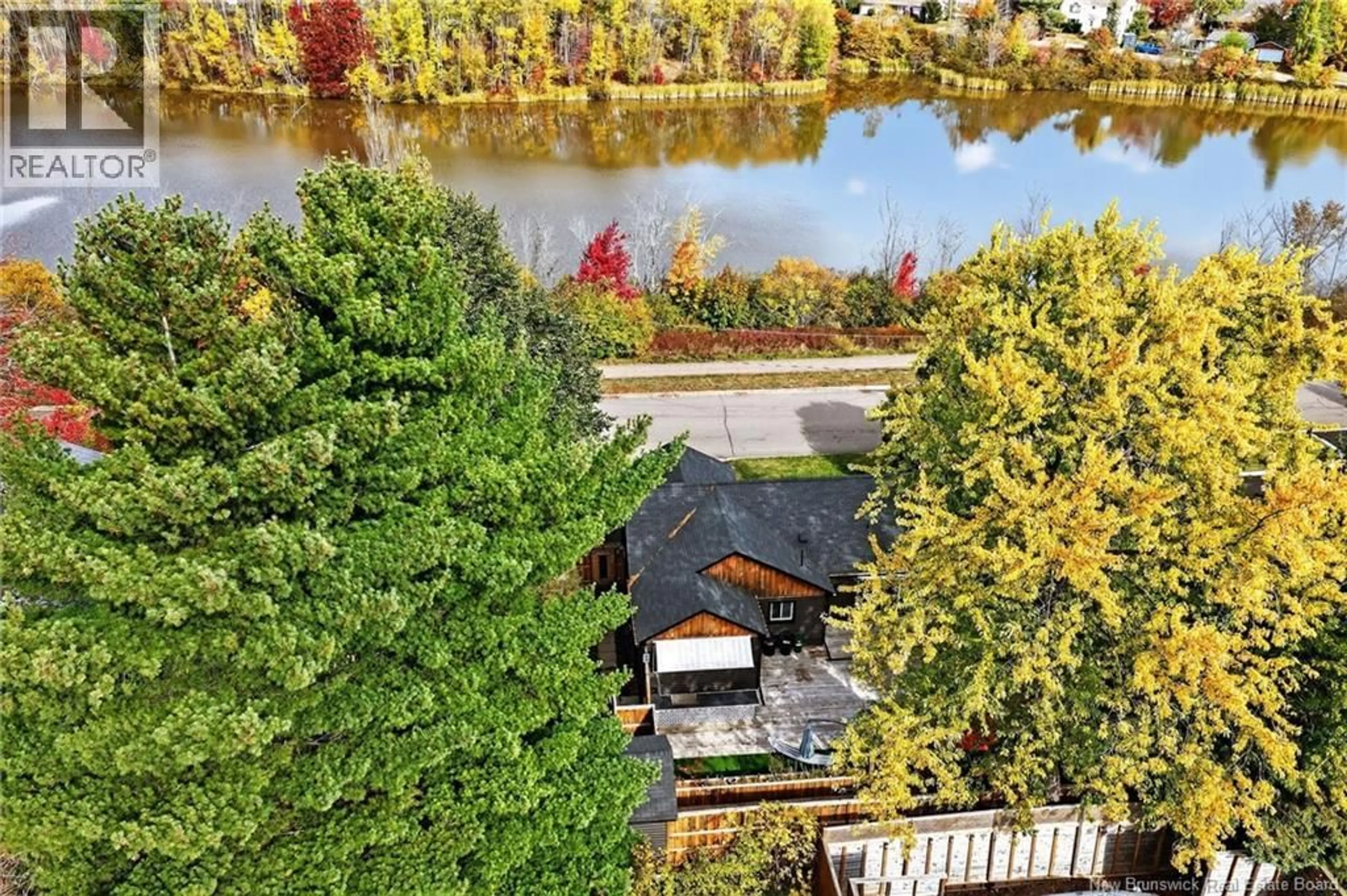 A pic from outside/outdoor area/front of a property/back of a property/a pic from drone, water/lake/river/ocean view for 300 WESTMOUNT BOULEVARD, Moncton New Brunswick E1E1V5