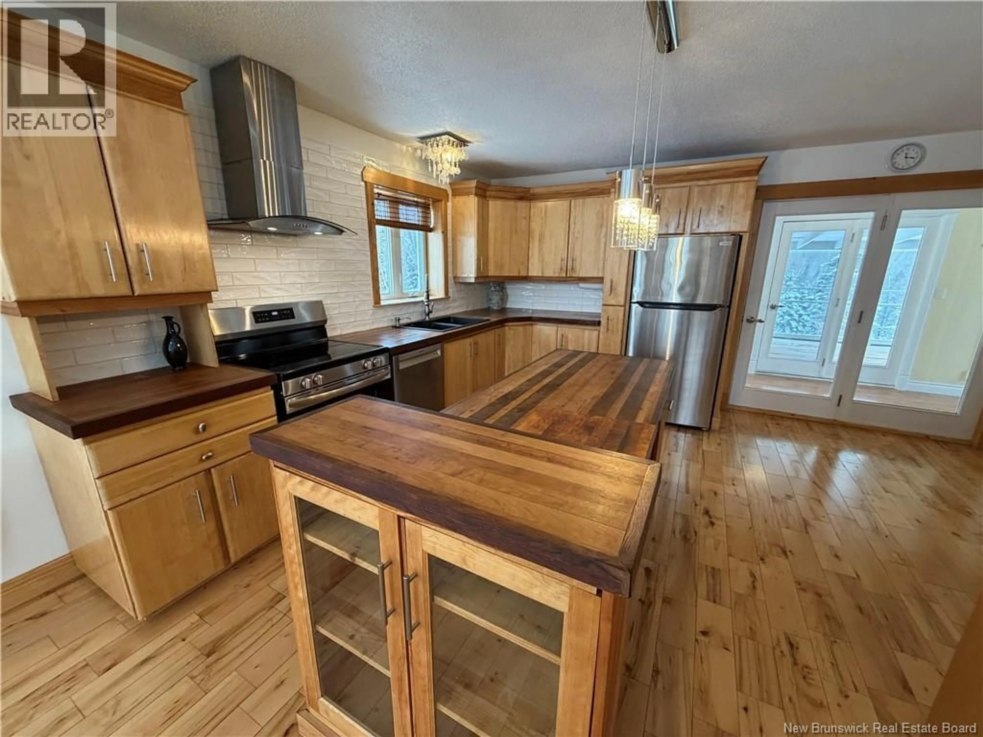 Open concept kitchen, wood/laminate floor for 2104 CORMIER, Sainte-Louise New Brunswick E8K2X6