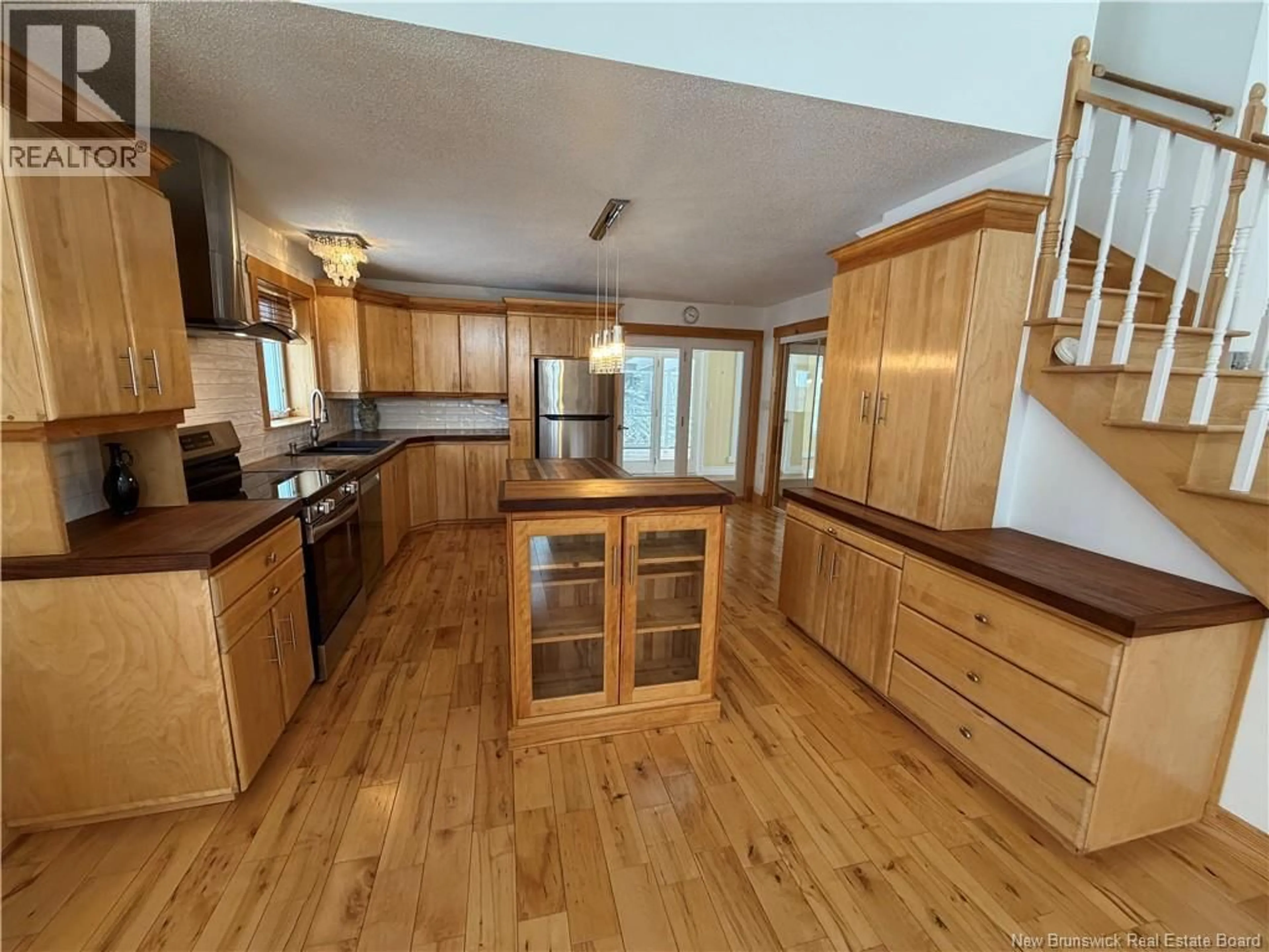Open concept kitchen, wood/laminate floor for 2104 CORMIER, Sainte-Louise New Brunswick E8K2X6