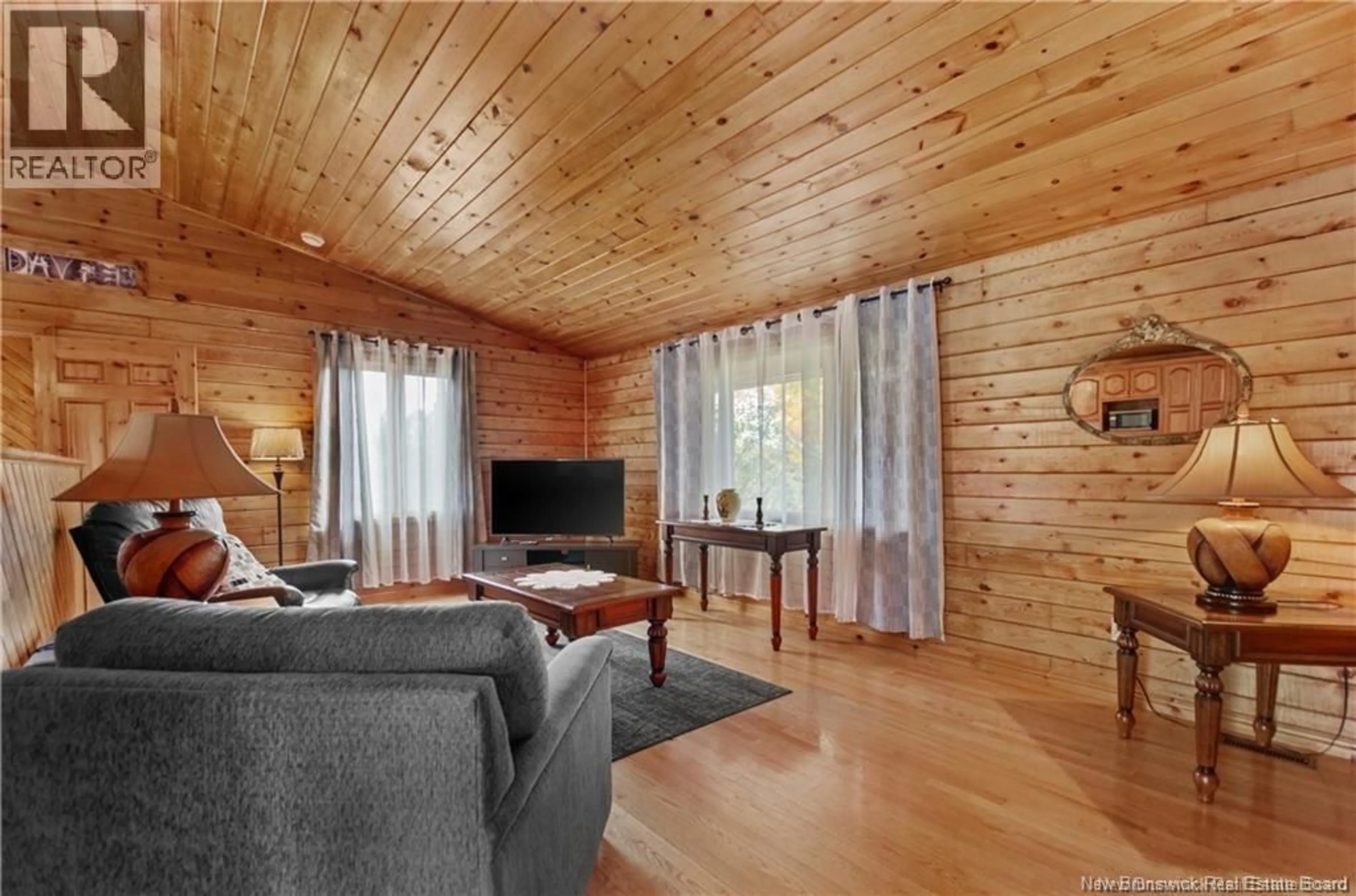 Living room with furniture, wood/laminate floor for 213 WARD SETTLEMENT BRANCH ROAD, Ward Settlement New Brunswick E6B2A3