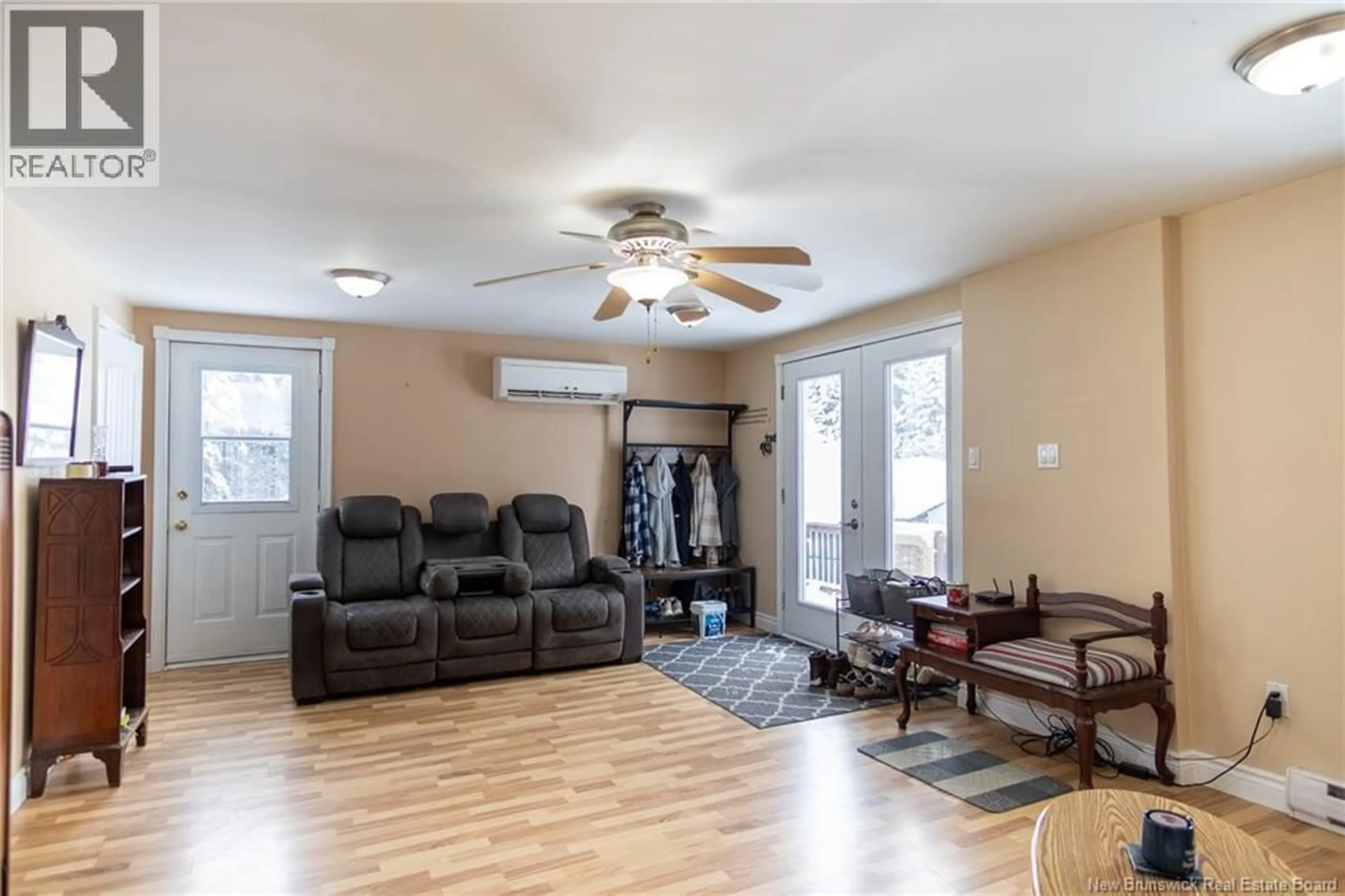 Living room with furniture, wood/laminate floor for 349 MILKISH CREEK ROAD, Summerville New Brunswick E5S1V7