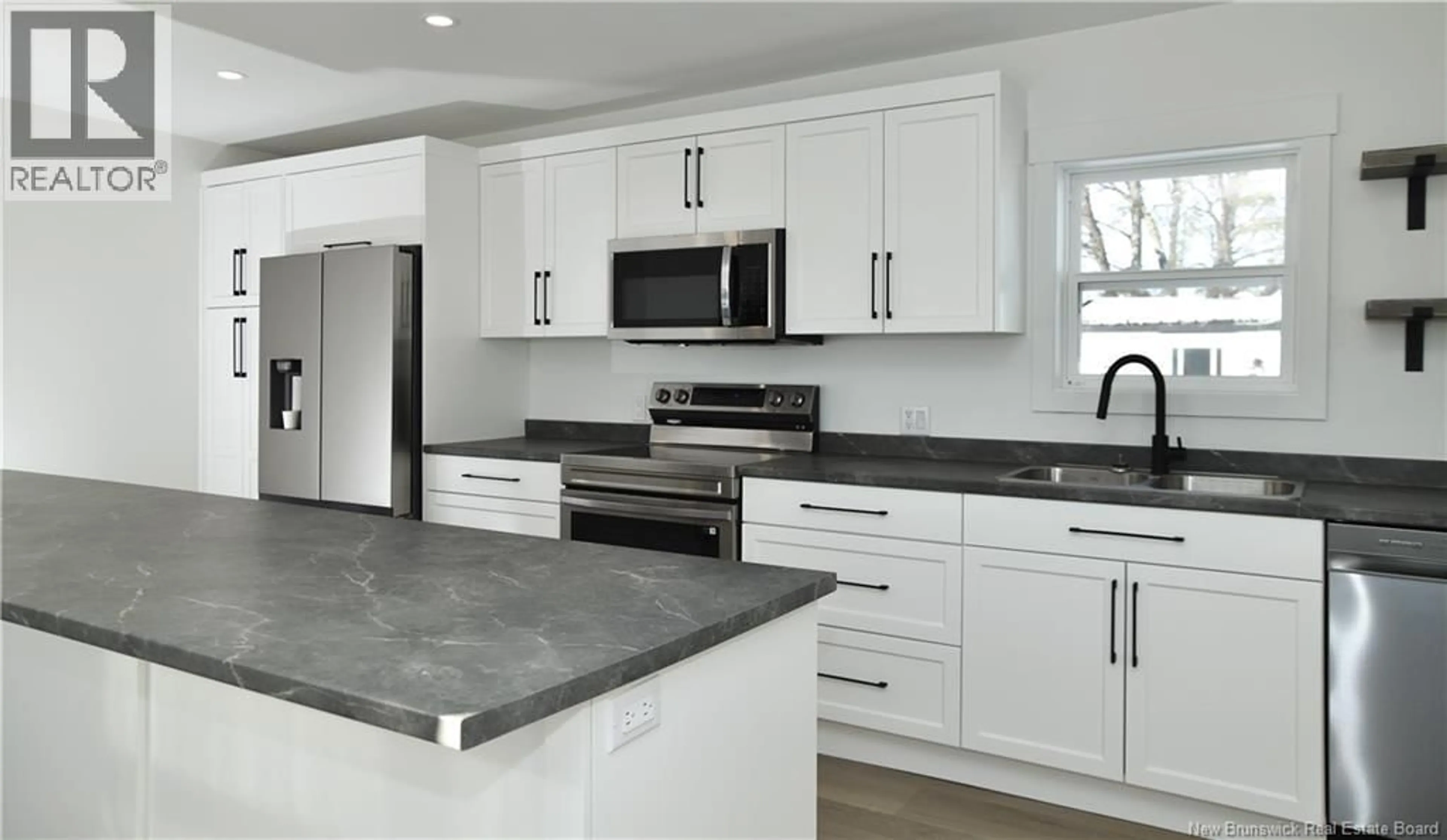 Open concept kitchen, ceramic/tile floor for 200 JUBILEE STREET, Shediac New Brunswick E4P1X5