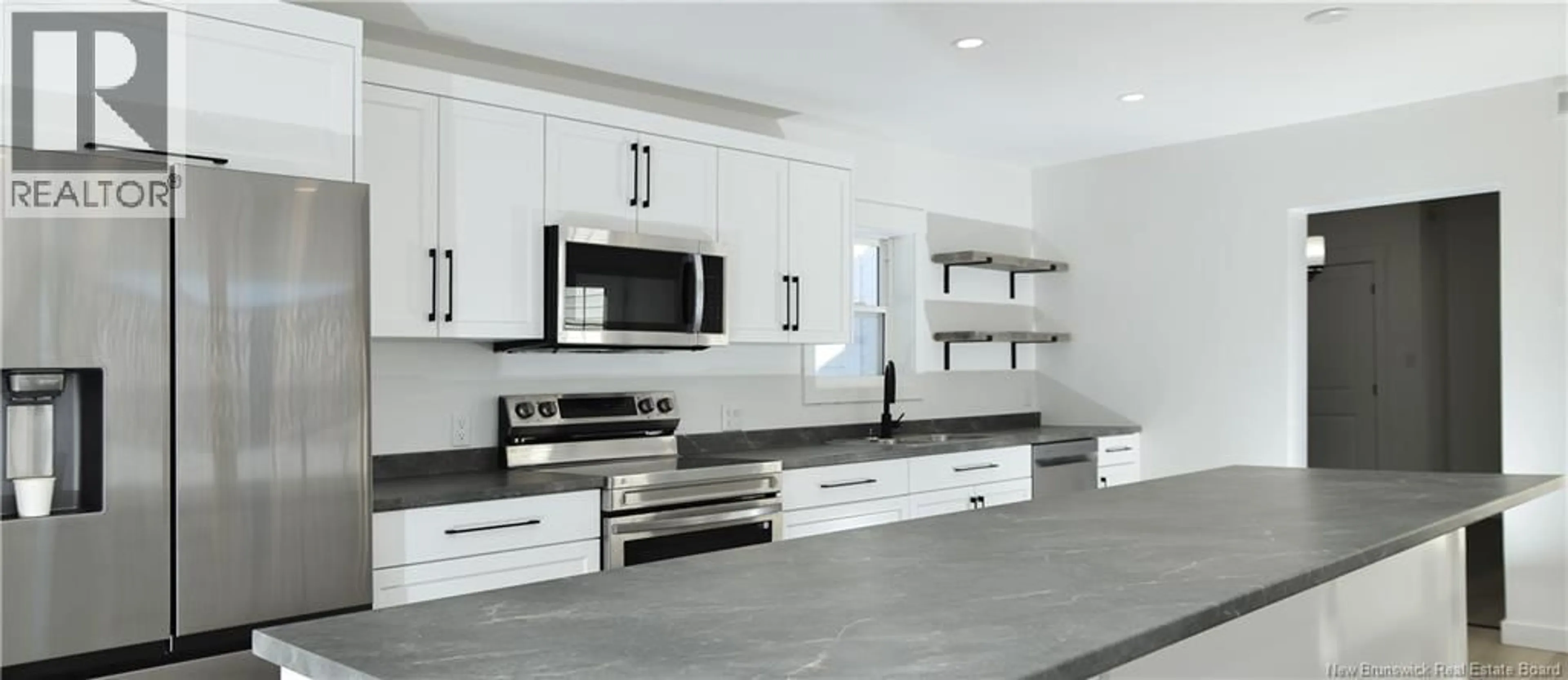 Open concept kitchen, ceramic/tile floor for 200 JUBILEE STREET, Shediac New Brunswick E4P1X5