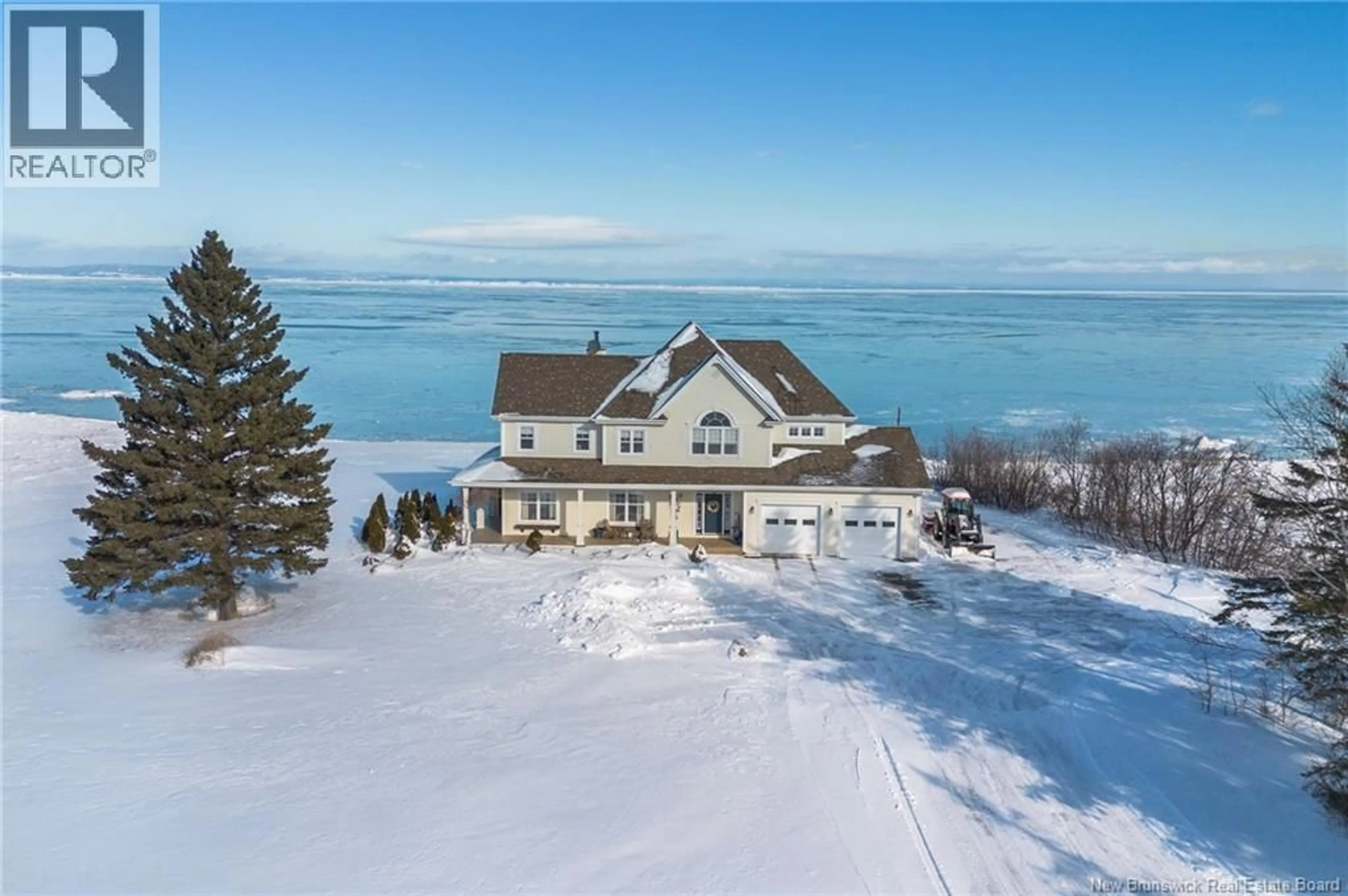 A pic from outside/outdoor area/front of a property/back of a property/a pic from drone, water/lake/river/ocean view for 218 MAIN, Belledune New Brunswick E8G2L7