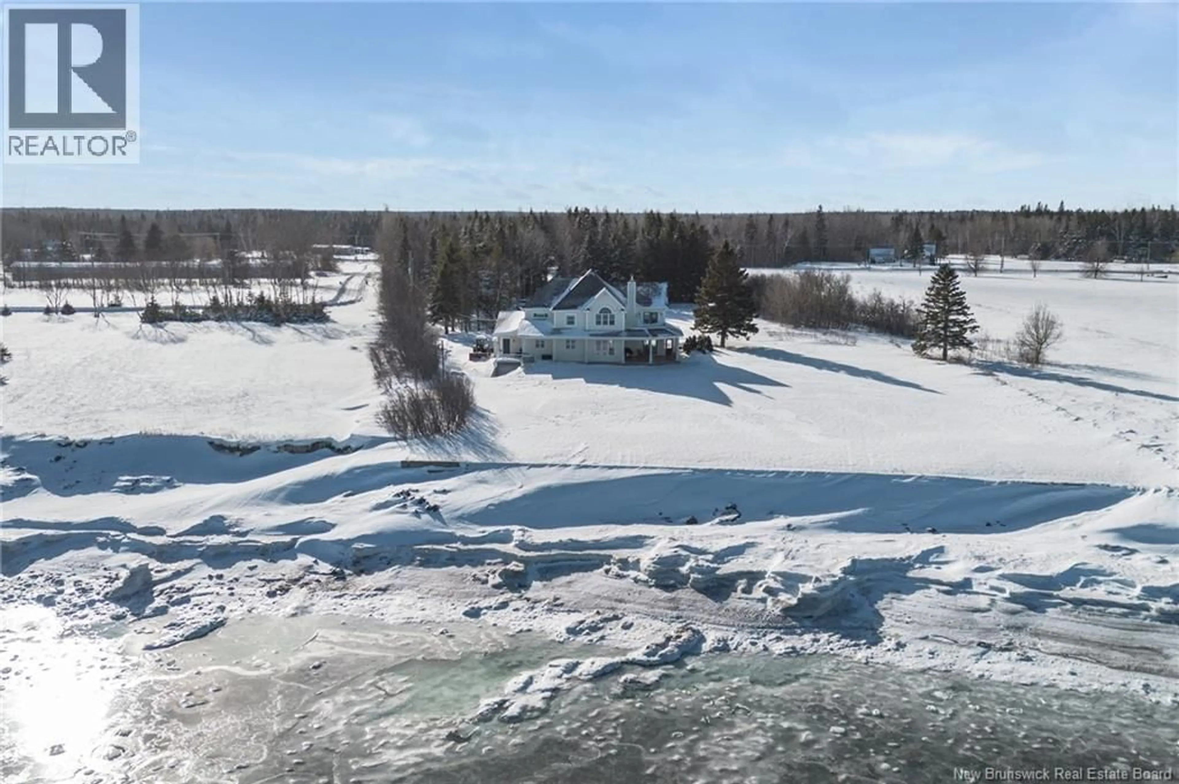 A pic from outside/outdoor area/front of a property/back of a property/a pic from drone, water/lake/river/ocean view for 218 MAIN, Belledune New Brunswick E8G2L7
