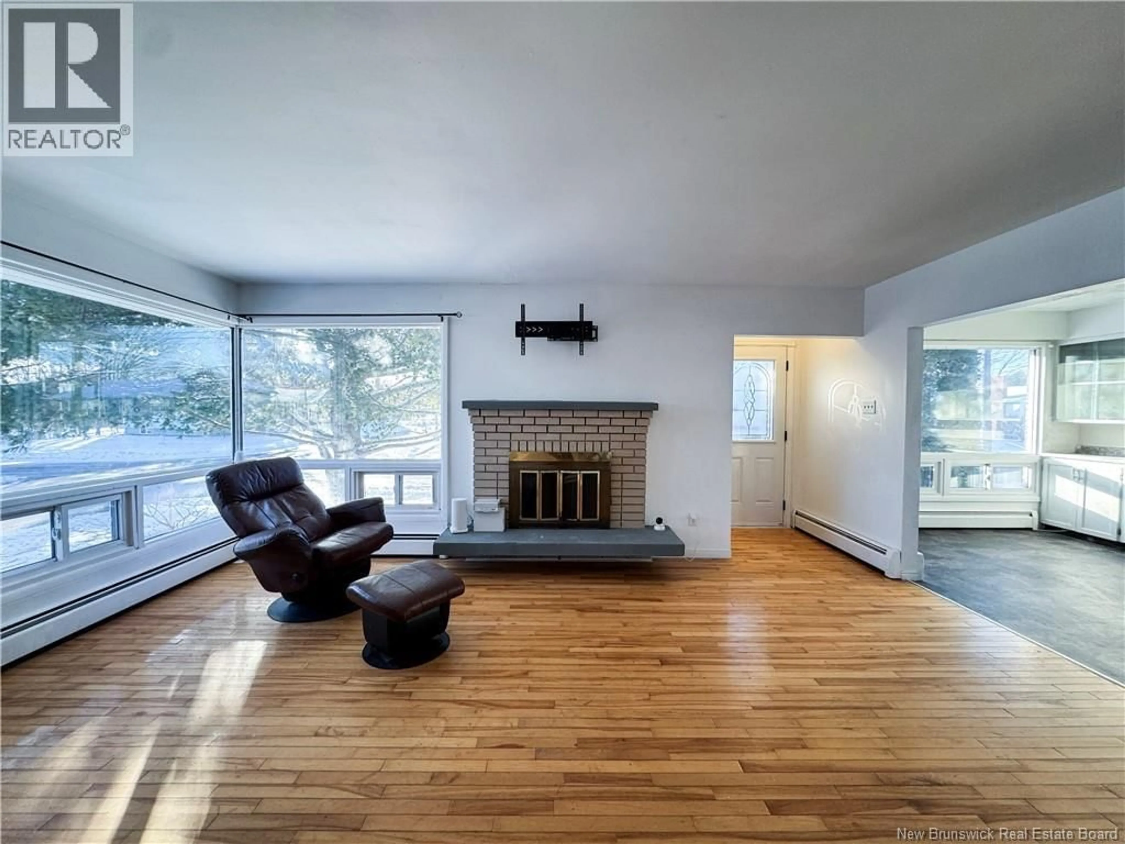 Living room with furniture, wood/laminate floor for 129 MCKENZIE AVENUE, Moncton New Brunswick E1C7Z1