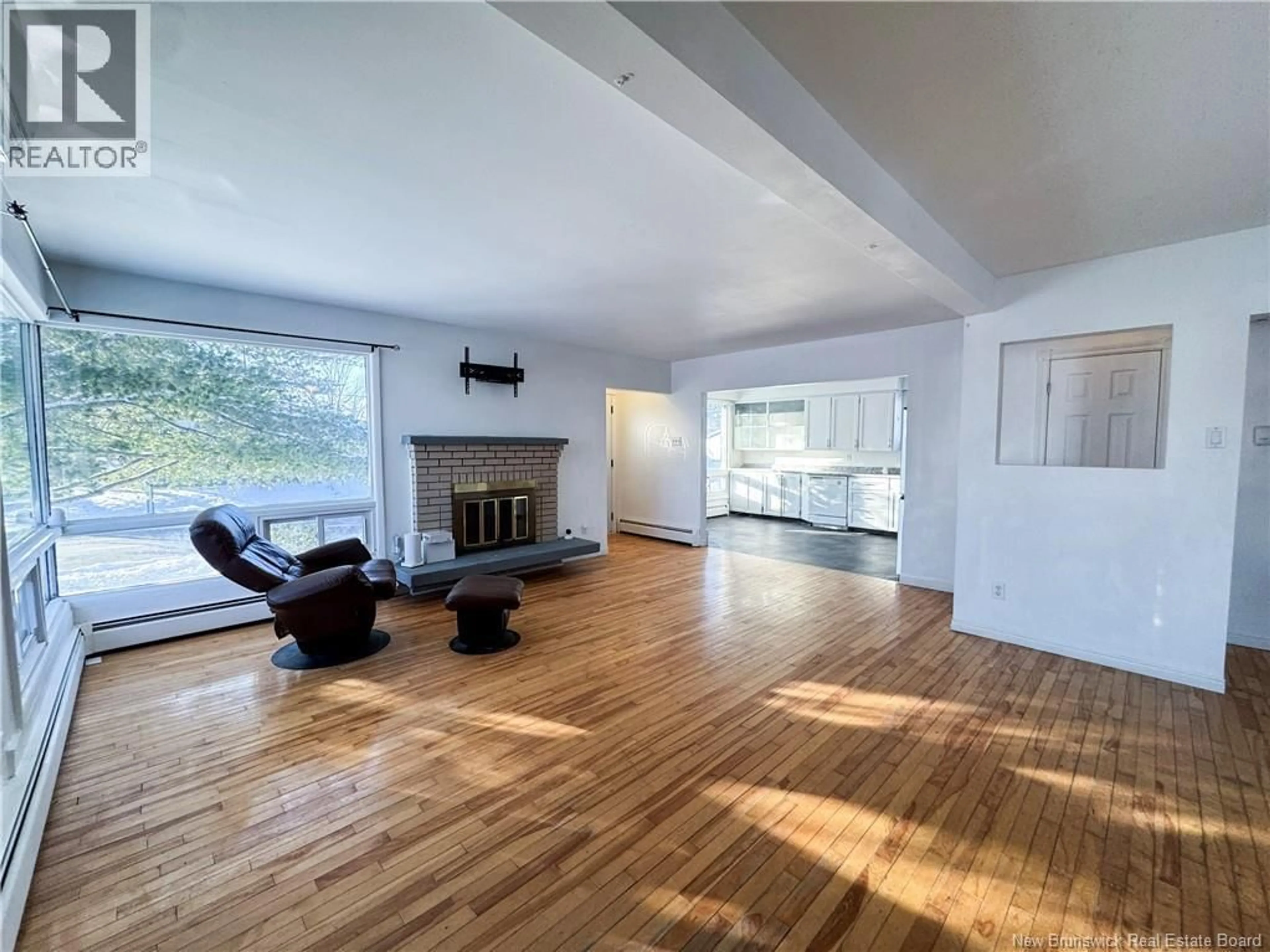 Living room with furniture, wood/laminate floor for 129 MCKENZIE AVENUE, Moncton New Brunswick E1C7Z1