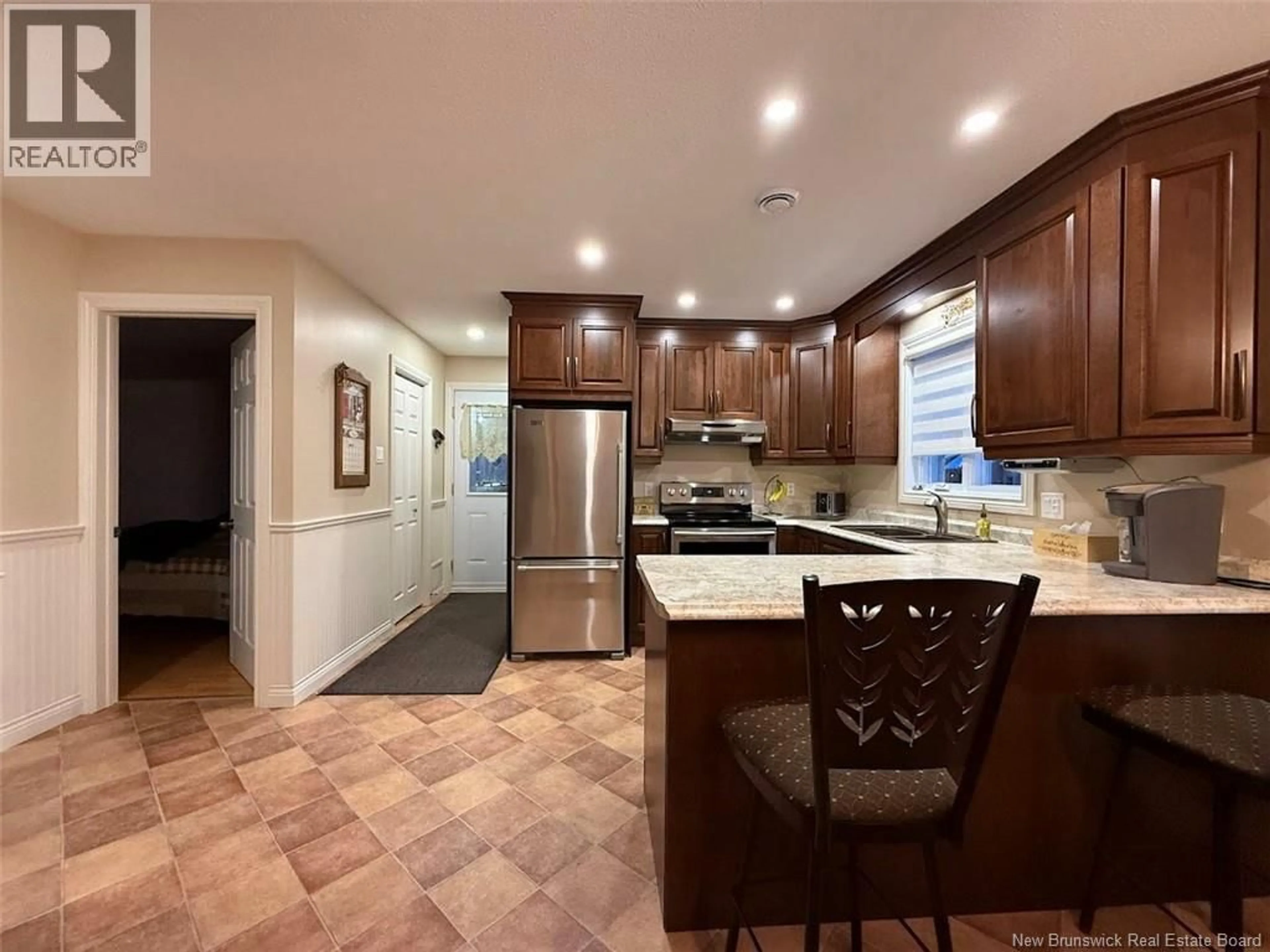 Open concept kitchen, ceramic/tile floor for 56 BELISLE AVENUE, Edmundston New Brunswick E3V3W7