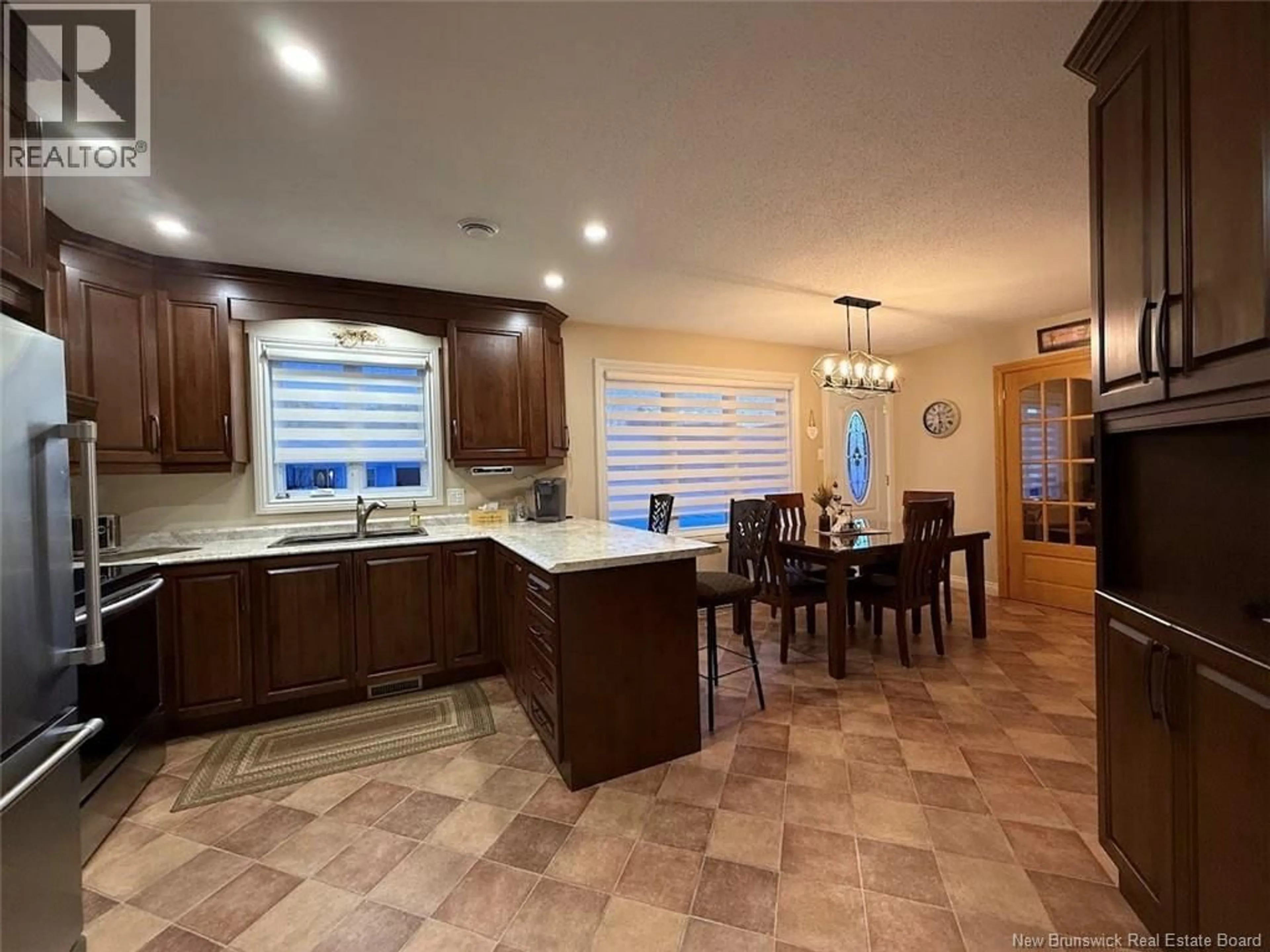 Open concept kitchen, ceramic/tile floor for 56 BELISLE AVENUE, Edmundston New Brunswick E3V3W7